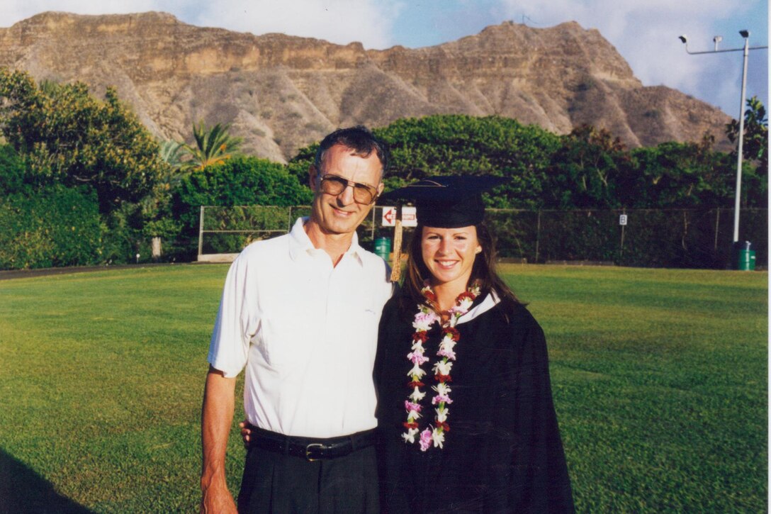 Chief Master Sgt. Jackie-Lynn Brown, Barnes Center for Enlisted Education, Director of Education poses for a graduation photo with her father, Jack Brown, after receiving her Bachelor's degree from Hawaii Pacific University, May 1998. Chief Brown has continued her education and received a master's degree and doctorate of Philosophy in Organization and Management. U.S. Air Force courtesy photo
