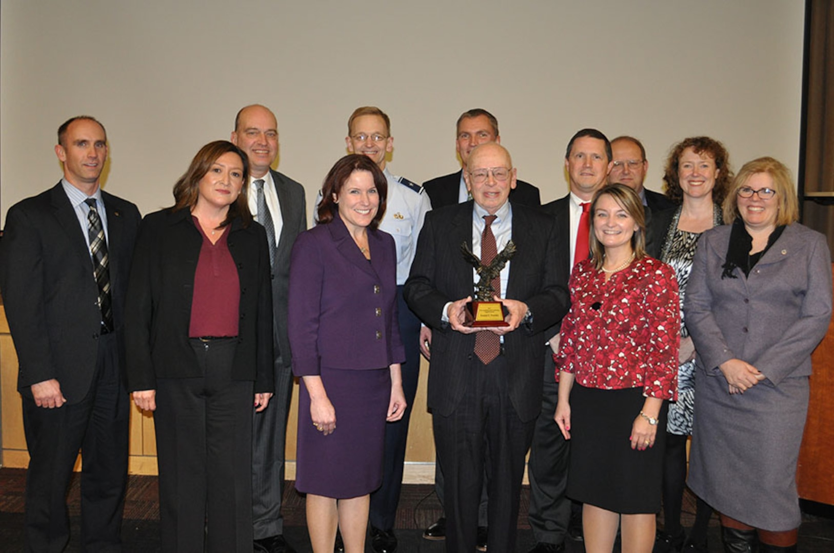 Defense Logistics Agency senior leaders and DLA Energy employees attend the ceremony to witness and honor Donald Peschka for his work earning the Under Secretary of Defense for Acquisition, Technology and Logistics Acquisition and Contracting Legends Award. 