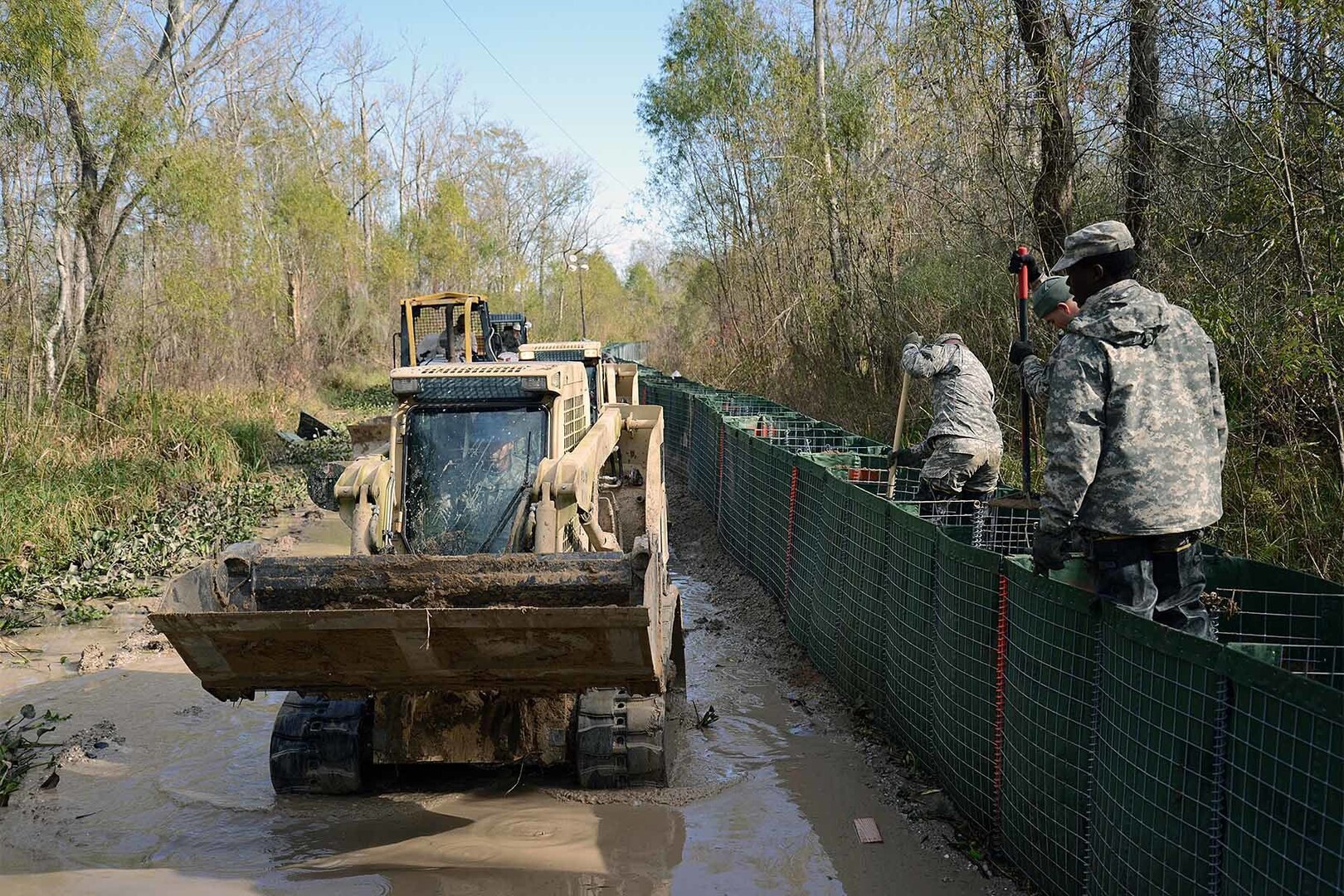 The Louisiana National Guard continues to work around the clock, constructing HESCO barrier levees on Avoca Island, Louisiana, Jan. 11, 2016. The project will prevent backwater flooding from reaching Morgan City and other towns in south Louisiana due to high river levels. 