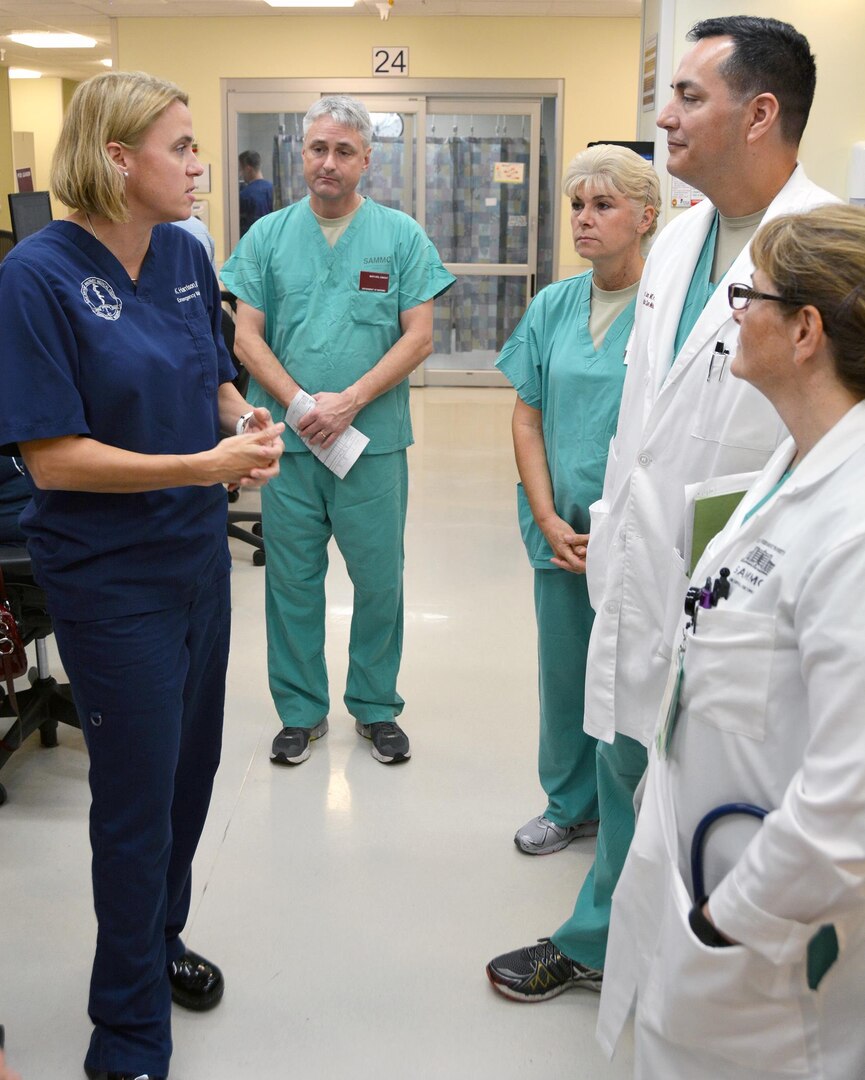 Dr. Katherine Harrison (left), discusses emergency department operations with(from left) Sgt. Maj. Dwight Wafford, Col. Kelly Bramley, Col. Pedro Lucero and Col. Kimberly Pietszak during Reverse Cycle Leadership Rounding Dec. 11, 2015.