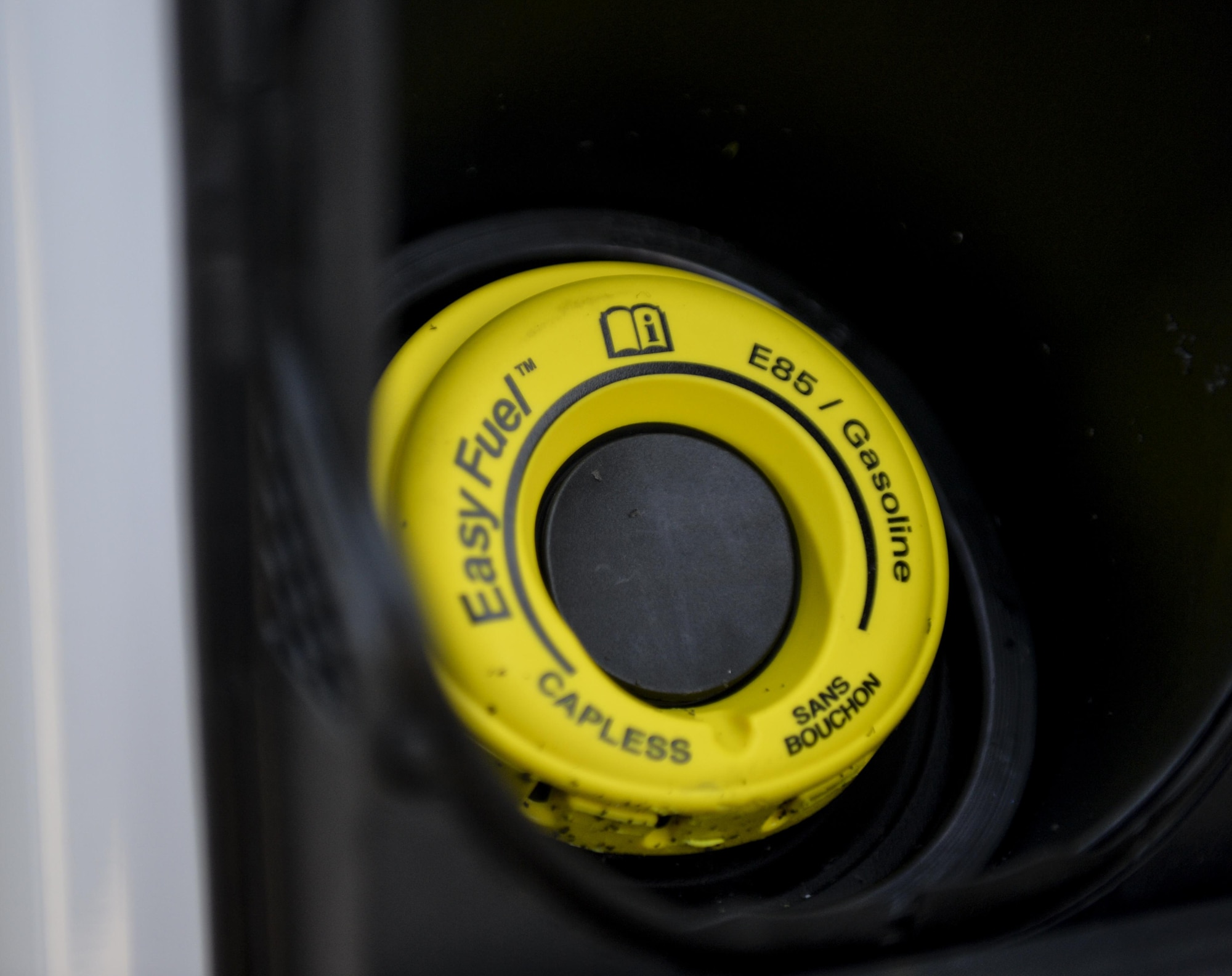 A yellow gas cap is on new vehicles recently received by the 2nd Logistics Readiness Squadron vehicle management flight at Barksdale Air Force Base, La., Jan. 11, 2016. The yellow cap is a visible indicator that the car uses flex fuel, which burns less fossil fuel and requires Airmen to use the correct fuel. (U.S. Air Force photo/Airman 1st Class Mozer O. Da Cunha) 