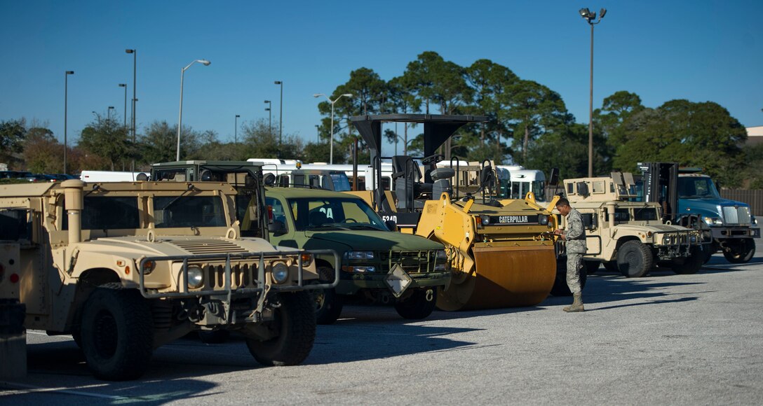 Airman 1st Class Jordan Artis, a vehicle management analysis journeyman with the 1st Special Operations Logistics Readiness Squadron, performs a yard check on Hurlburt Field, Fla., Jan. 12, 2016. Yard checks are conducted to ensure vehicles are accounted for. (U.S. Air Force photo by Senior Airman Krystal M. Garrett) 