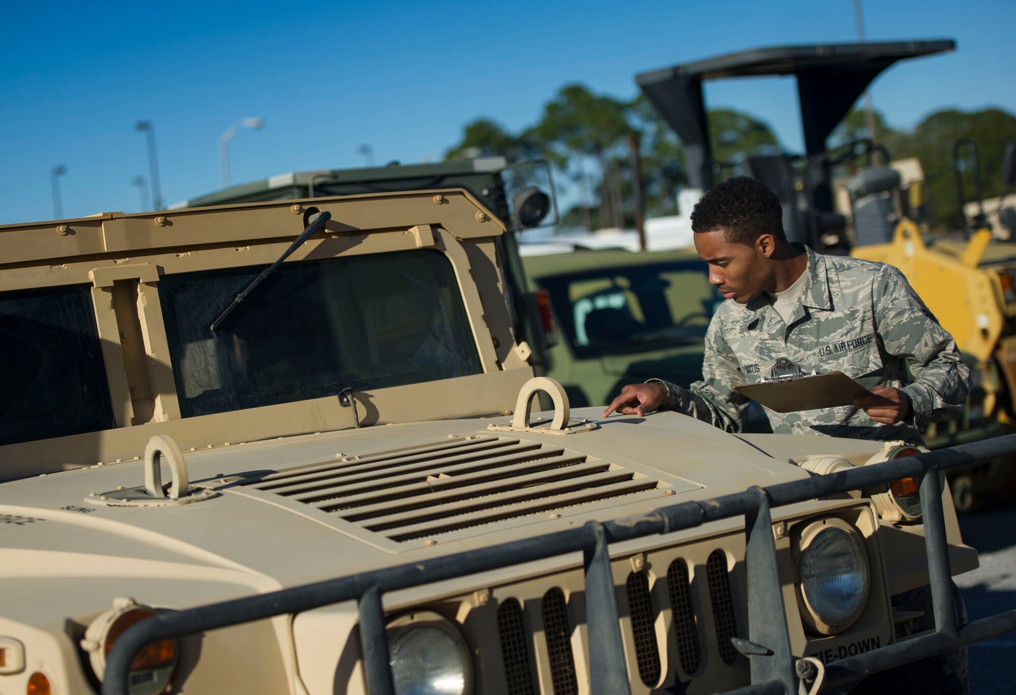 Airman 1st Class Jordan Artis, a vehicle management analysis journeyman with the 1st Special Operations Logistics Readiness Squadron, performs a yard check on Hurlburt Field, Fla., Jan. 12, 2016. There are approximately 100 different types of vehicles assigned to units at Hurlbrt. (U.S. Air Force photo by Senior Airman Krystal M. Garrett)