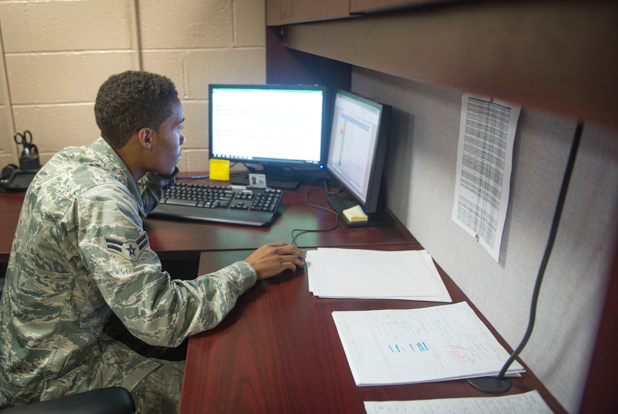 Airman 1st Class Jordan Artis, a vehicle management analysis journeyman with the 1st Special Operations Logistics Readiness Squadron, speaks with a unit Vehicle Control Officer on Hurlburt Field, Fla., Jan. 12, 2016. The Sterling, Va. native is in charge of the VCO program. (U.S. Air Force photo by Senior Airman Krystal M. Garrett)