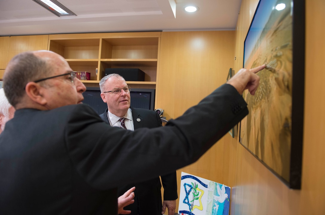 U.S. Deputy Defense Secretary Bob Work, back, looks at a photo with Israeli Defense Minister Moshe Yaalon in Tel Aviv, Israel, Jan. 14, 2016. DoD photo by Navy Petty Officer 1st Class Tim D. Godbee