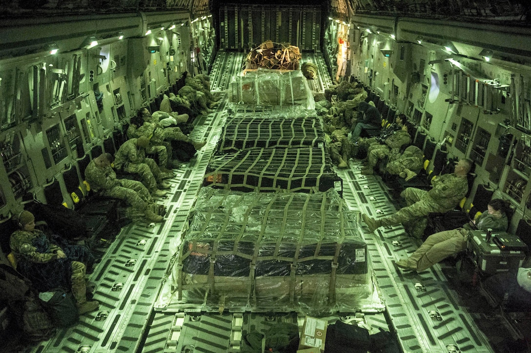 A U.S. Air Force C-17 Globemaster III transports service members and cargo from Al Udeid Air Base in Qatar while supporting Operation Resolute Support, Jan. 13, 2016. U.S. Air Force photo by Staff Sgt. Corey Hook