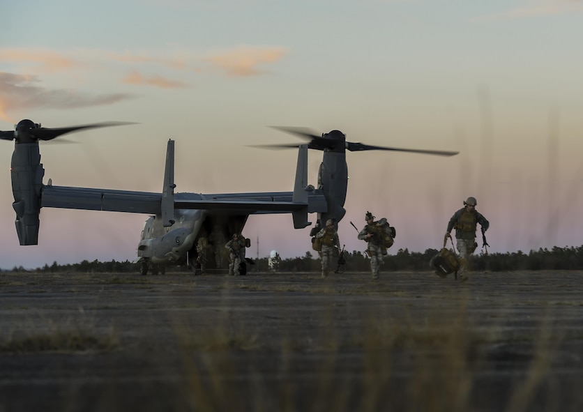 Security forces members with the 1st Special Operations Security Forces Squadron debark a CV-22 Osprey during exercise Frigid Archer 2016 on Eglin Range, Fla., Jan. 6, 2016. Frigid Archer was a week-long exercise that tested 1st Special Operations Wing Air Commandos' expertise through a myriad of operational and support requirements. (U.S. Air Force photo by Senior Airman Ryan Conroy)  