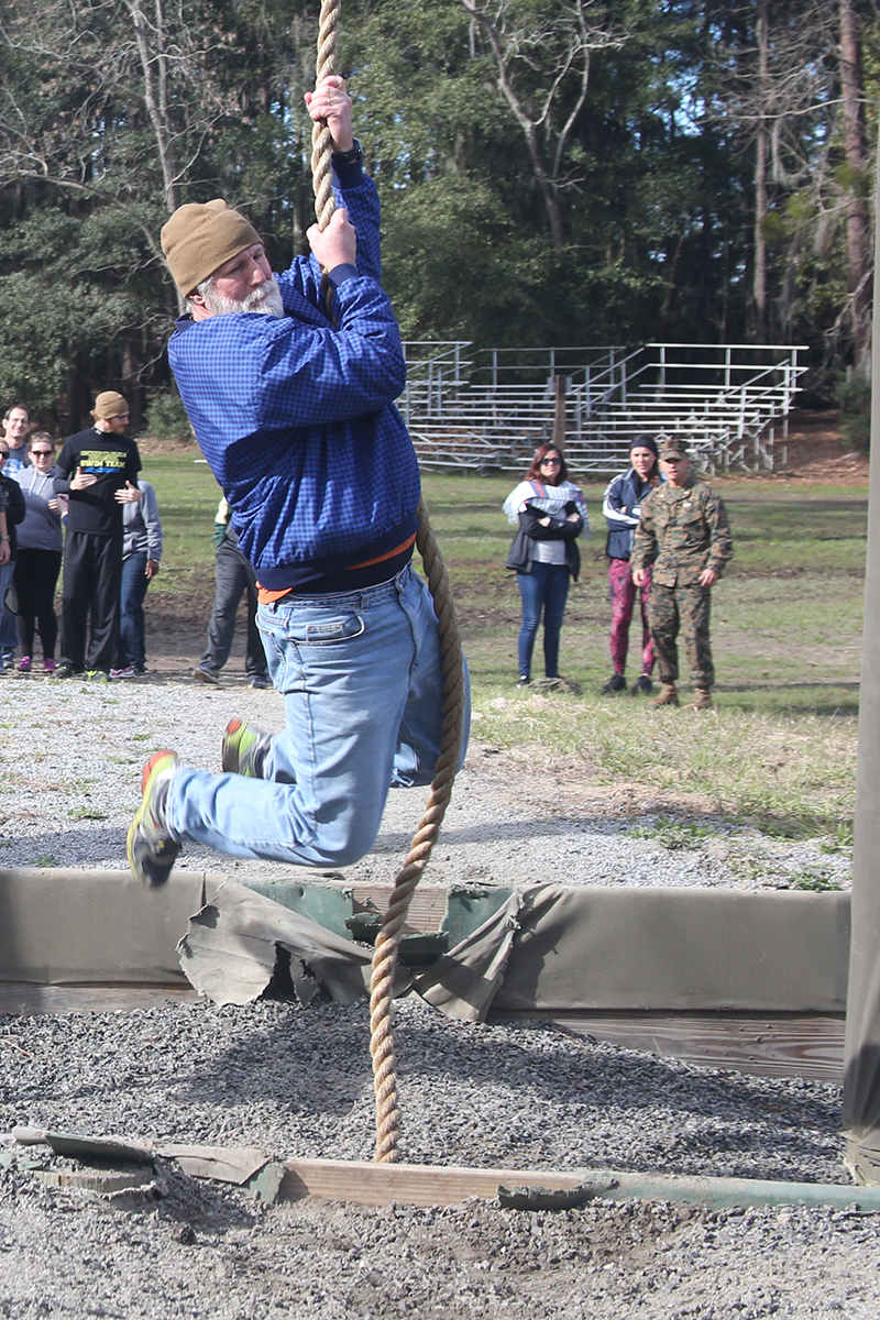 Mark McCatty, a leadership coach and part of the Recruiting Station Orlando group, swings across the ditch below in one of the obstacles that make up the Confidence Course, aboard Marine Corps Recruit Depot Parris Island, S. C., January 14, 2016. The teachers, coaches and principals are part of a larger group of 80 high school educators from Florida selected to participate in a three-day workshop designed to inform educators about military service and life in the Marine Corps. (Official Marine Corps photo by Cpl. John-Paul Imbody)