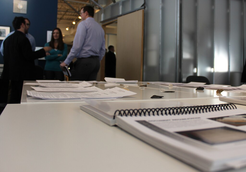 Veterans' resumes are laid out during an open house at the Veterans Curation Program office in Alexandria, Virginia, Jan. 12, 2016. The VCP provides employment and vocational training for five months for recently separated veterans using archaeological collections administered by the U.S. Army Corps of Engineers. Veterans working in the Alexandria laboratory are trained in data entry, report writing, photography, and scanning technologies.(U.S. Army Photo by Sarah Gross) 

