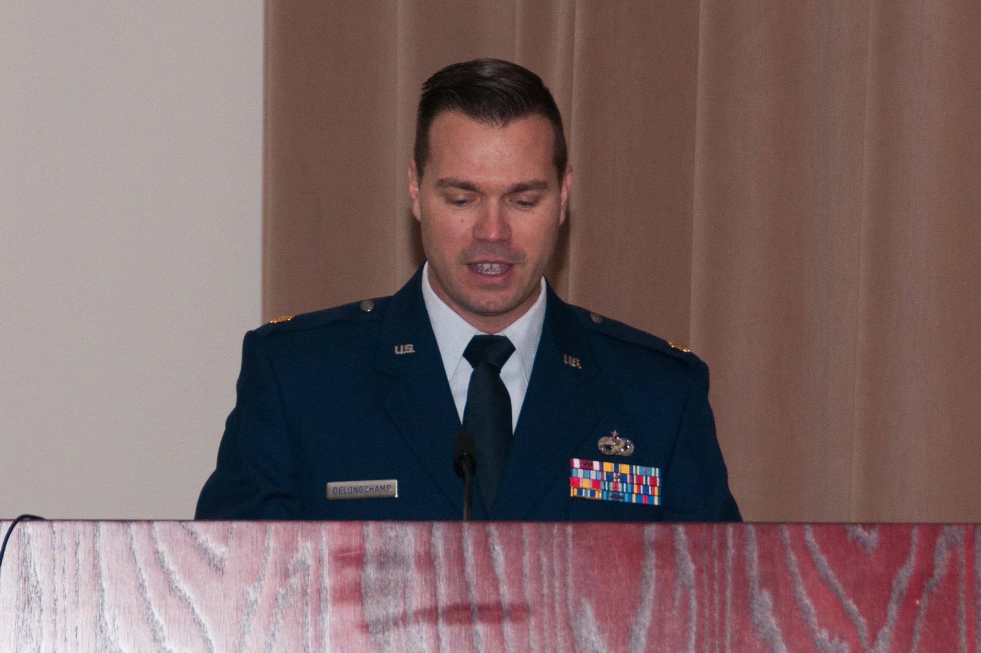 U.S. Air Force Maj. Charles R. DeLongchamp III, commander of the 307th Logistics Readiness Squadron (LRS), addresses the troops at a change of command ceremony on Jan. 9, 2016, Barksdale Air Force Base, La. DeLongchamp is assuming command of the LRS at Barksdale after being the Logistics Readiness Division Chief, 10th Air Force, Naval Air Station Joint Reserve Base Fort Worth, Texas. (U.S. Air Force photo by Master Sgt. Laura Siebert/Released)