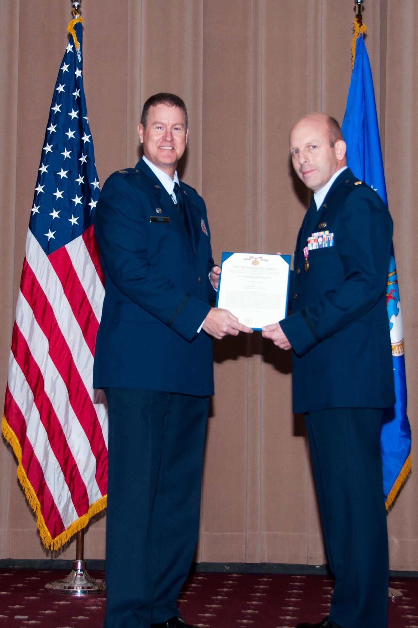 U.S. Air Force Col. William A. Rock (left), 307th Mission Support Group commander, presents a Meritorious Service Medal second oak leaf cluster to Maj. Jody L. Kaiser, commander of the 307th Logistics Readiness Squadron on Barksdale Air Force Base, La., Jan. 9, 2016. Kaiser is receiving the medal before relinquishing his command to Maj. Charles R. DeLongchamp III. (U.S. Air Force photo by Master Sgt. Laura Siebert/Released)