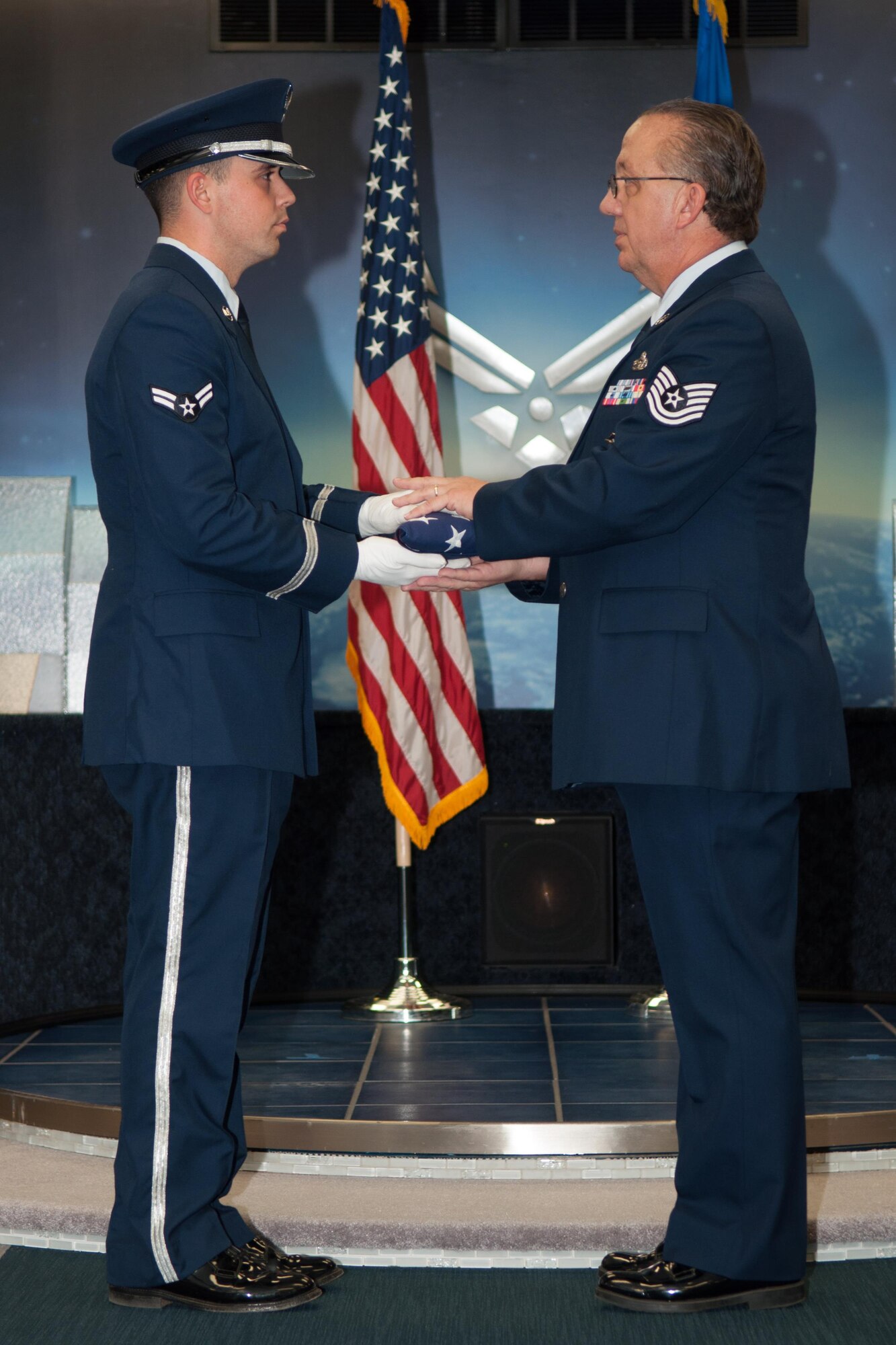 U.S. Air Force Tech. Sgt. Melvin Cargill is presented a flag during his retirement ceremony from the 2nd Bomb Wing Honor Guard at Barksdale Air Force Base, La, on Jan. 9, 2016. Cargill is retiring from the 307th Security Forces Squadron after 33 years. (U.S. Air Force photo by Master Sgt. Dachelle Melville/Released)