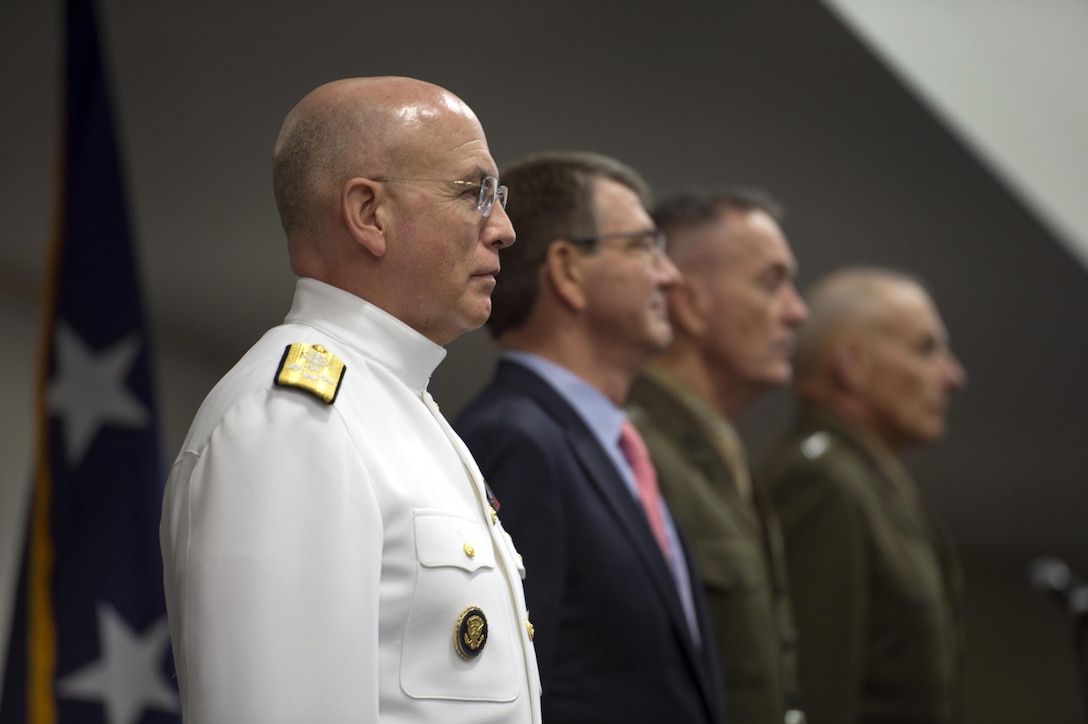Left to right: Navy Adm. Kurt W. Tidd; Defense Secretary Ash Carter; Marine Corps Gen. Joseph F. Dunford Jr., chairman of the Joint Chiefs of Staff; and Marine Corps Gen. John F. Kelly stand during the change-of-command ceremony for the U.S. Southern Command at the command's headquarter in Miami, Jan. 14, 2016. DoD photo by EJ Hersom