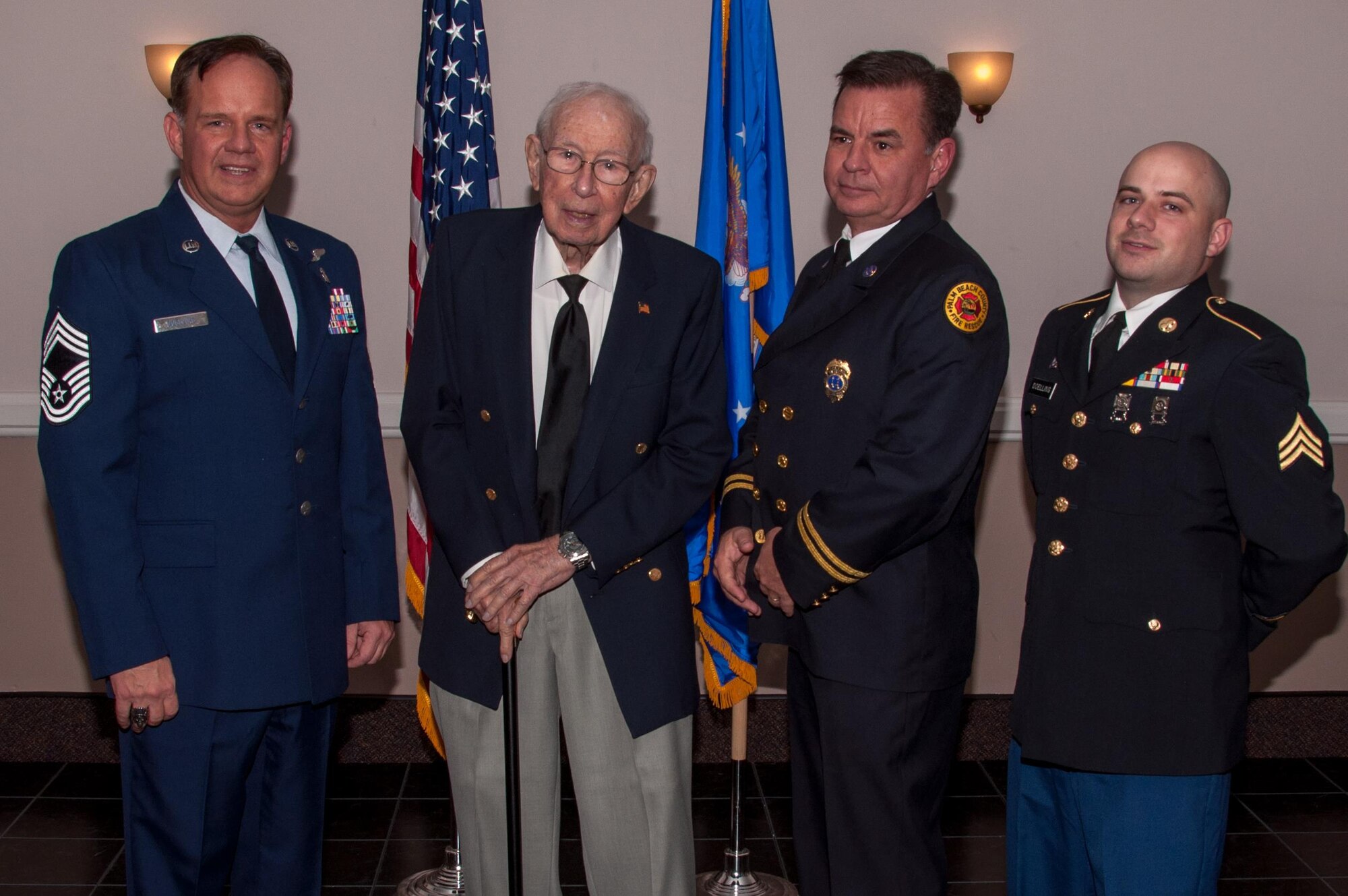 The Doelling family gathers for the retirement ceremony of U.S. Air Force Chief Master Sgt. Michael Doelling on Jan. 09, 2016, Barksdale Air Force Base, La.  The men of the Doelling family have served in the United States military for seven generations. Lewis Doelling and his brother Larry served in WWII. Larry perished when the bomber, a B-24 Liberator named the Lily Marlene, crashed on a night training exercise on Sep. 9, 1944. (U.S. Air Force photo by Master Sgt. Laura Siebert/Released)
