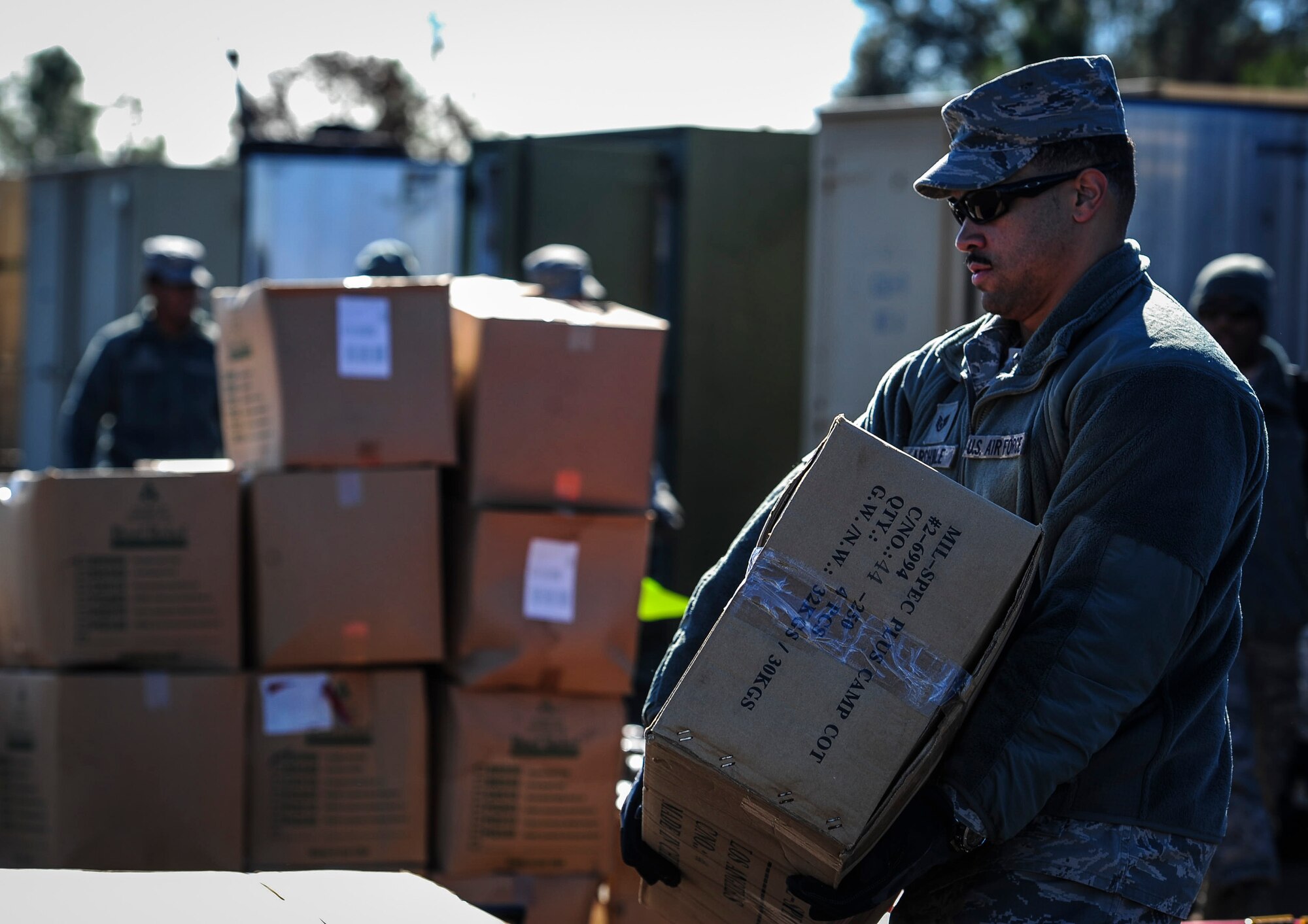 Staff Sgt. Darius Archible, a structural craftsman with the 1st Special Operations Civil Engineering Squadron, helps unload boxes of cots during exercise Frigid Archer at Eglin Range, Fla., Jan. 6, 2016. Basic fundamentals of J-team were recently tested and trained when an Air Rapid Response Kit (ARRK) was deployed during exercise Frigid Archer, to demonstrate the distinctive capabilities of what the personnel and equipment can accomplish. (U.S. Air Force photo by Senior Airman Meagan Schutter)