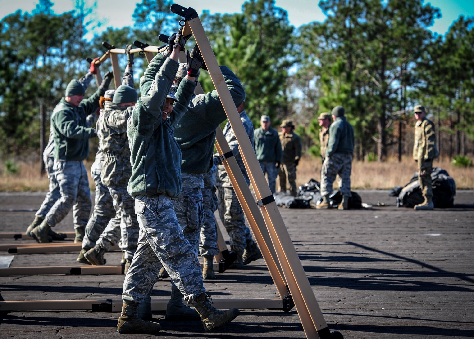 Airmen with the 1st Special Operations Civil Engineering Squadron set up a temporary living unit during exercise Frigid Archer at Eglin Range, Fla., Jan. 6, 2016. Basic fundamentals of J-team were recently tested and trained when an Air Rapid Response Kit (ARRK) was deployed during exercise Frigid Archer, to demonstrate the distinctive capabilities of what the personnel and equipment can accomplish. (U.S. Air Force photo by Senior Airman Meagan Schutter)