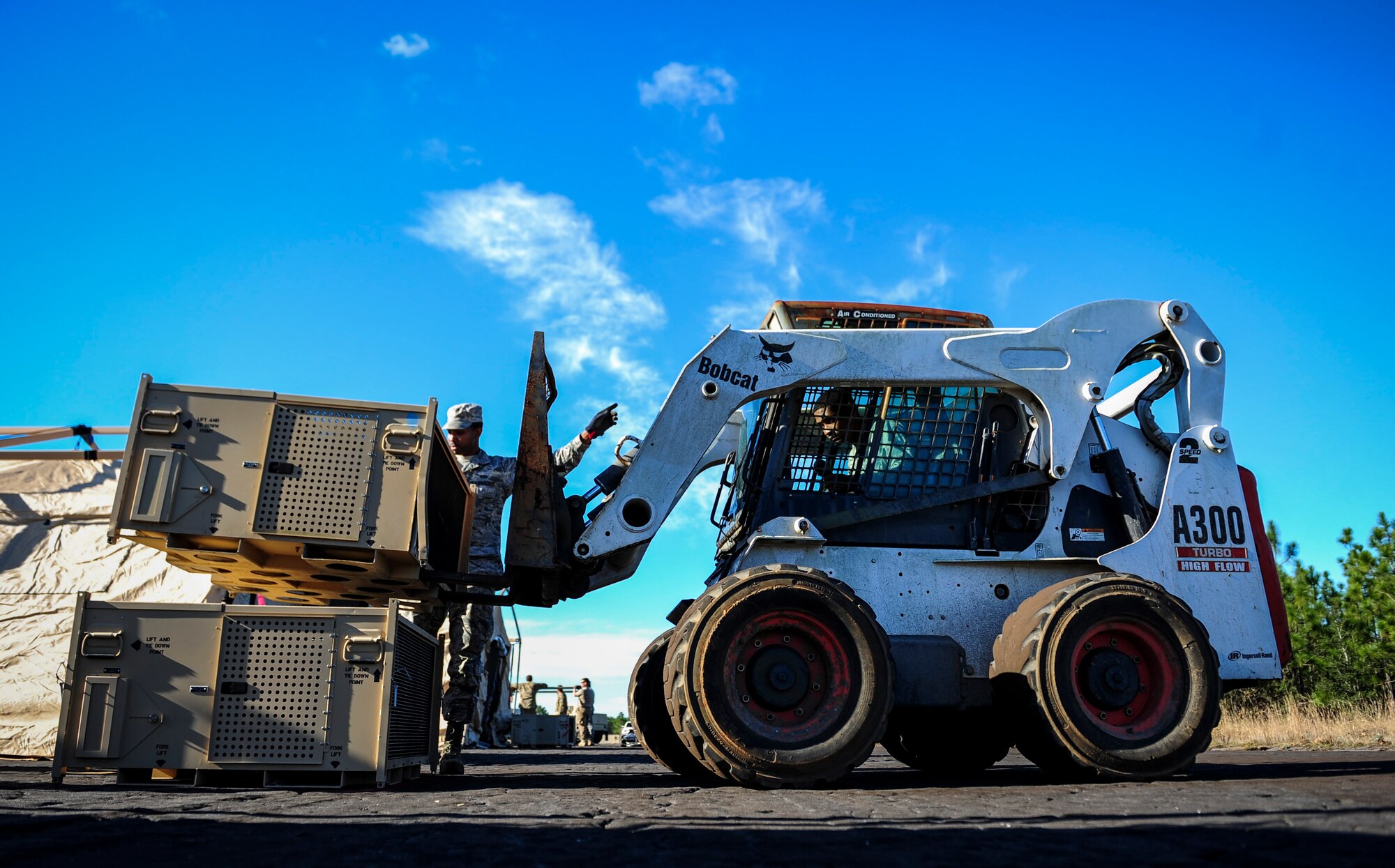 Airman 1st Class Samuel Garnett, a heavy equipment operator with the 1st Special Operations Civil Engineering Squadron, moves heating and air units during exercise Frigid Archer at Eglin Range, Fla., Jan. 6, 2016. There was a total of 250 Airmen participating in the exercise. Sixty Airmen came from the 1st SOCES. (U.S. Air Force photo by Senior Airman Meagan Schutter)