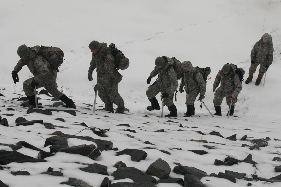 Soldiers participate in steep snow traverse training at Camp Ethan Allen Training Site in Jericho, Vt., Jan. 10, 2016. The soldiers are members of the Vermont National Guard. Vermont Army National Guard photo by Spc. Avery Cunningham