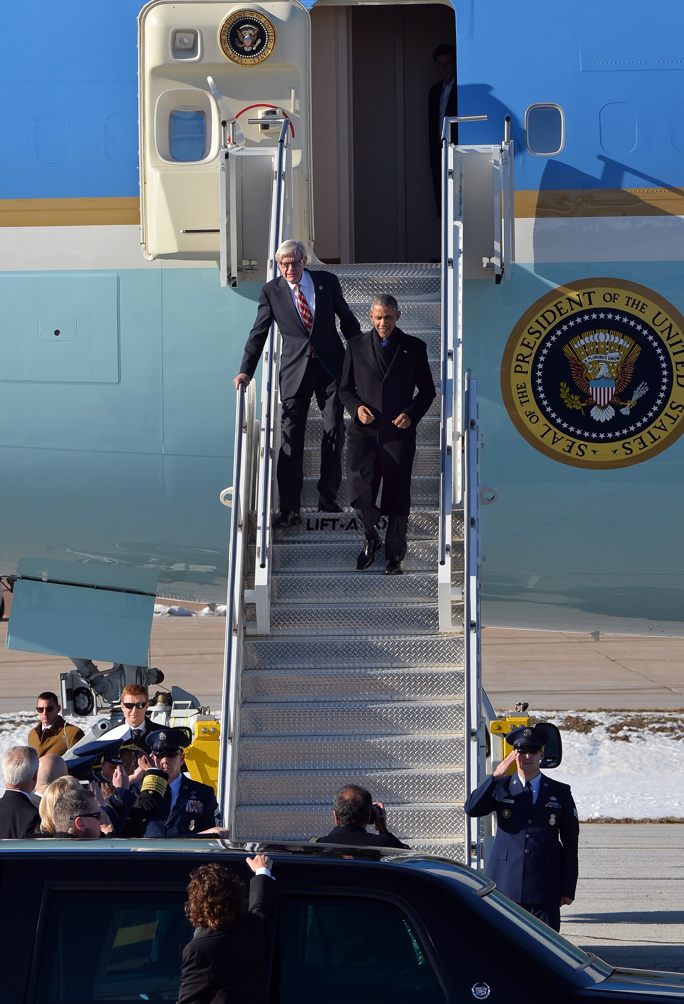 President Barack Obama descends the stairs out of Air Force One, along with Nebraska Congressman Brad Ashford, after landing at Offutt Air Force Base, Neb. Jan. 13. President Obama was welcomed by base leadership as-well-as state and local officials.  (U.S. Air Force photo by Josh Plueger/Released)
