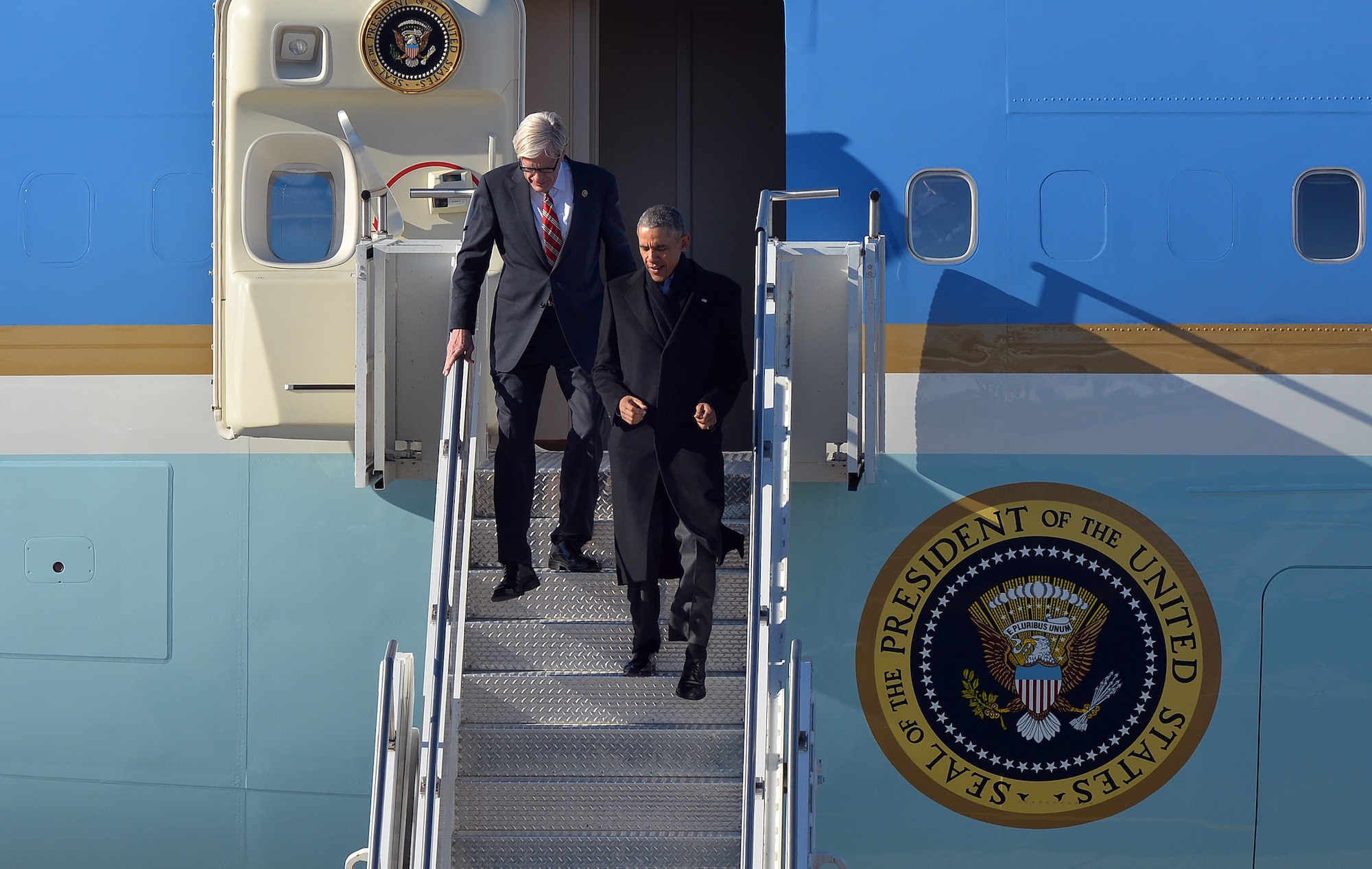 President Barack Obama steps out of Air Force One, along with Nebraska Congressman Brad Ashford, after landing at Offutt Air Force Base, Neb. Jan. 13. President Obama was welcomed by the leaders of U.S. Strategic Command, the 55th Wing, state and local officials.  (U.S. Air Force photo by Josh Plueger/Released)
