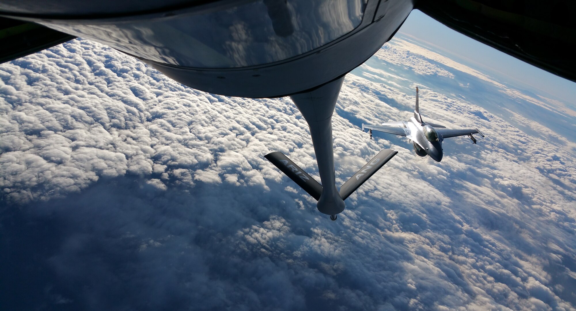 An F-16 Fighting Falcon takes on fuel from an Arizona Air National Guard KC-135 Stratotanker over northern Arizona during a training mission, Jan. 10. (U.S. Air National Guard photo by Tech. Sgt. Michael Matkin)