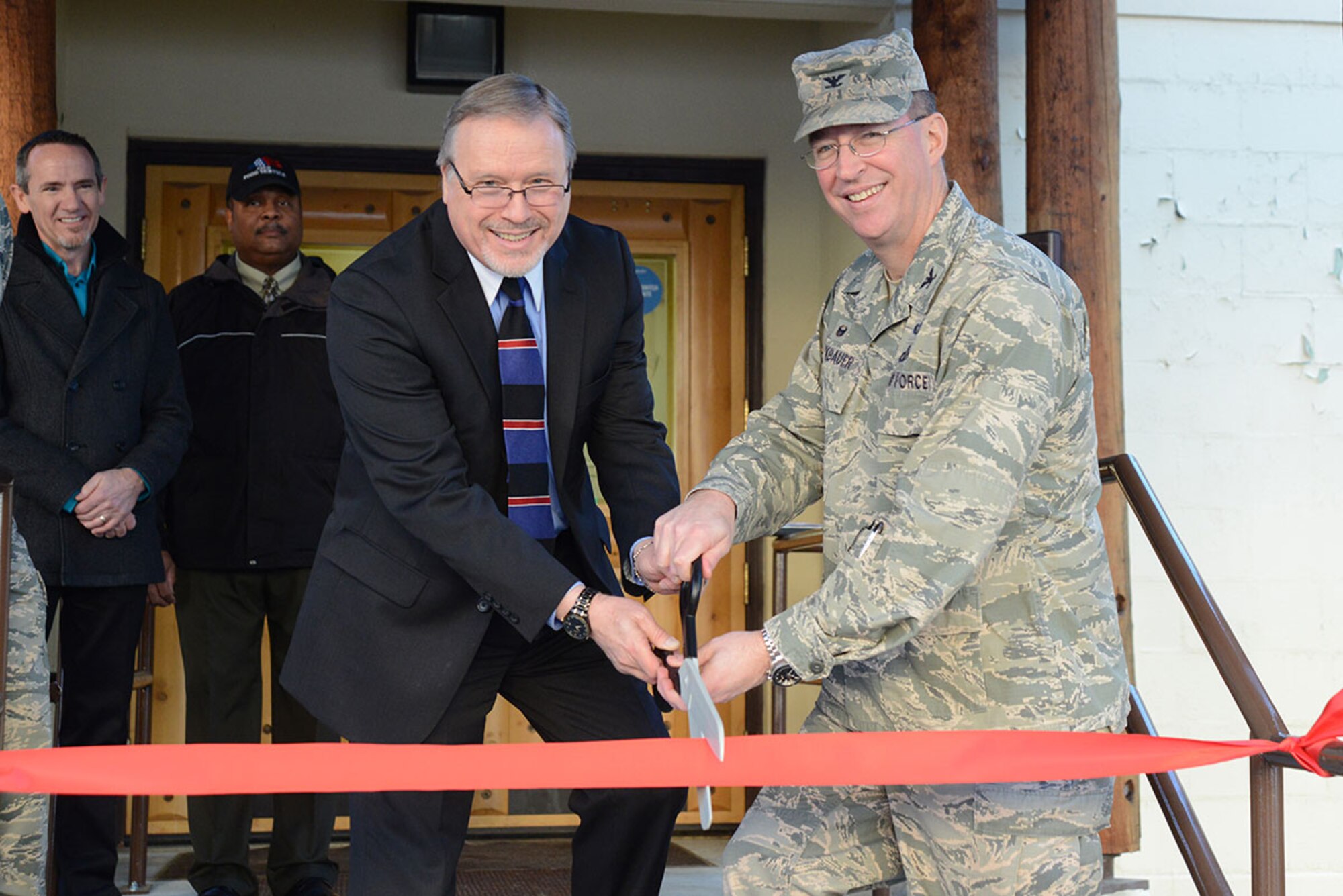 Air Force Col. Brian Bruckbauer, 673d Air Base Wing and Joint Base Elmendorf-Richardson commander, and Martin Alletson, JBER Aramark general manager, cut the ribbon for the Pico ‘n Salsa grand opening on JBER, Alaska, Jan. 11, 2016. Aramark and JBER worked together to create Pico ‘n Salsa after the JBER populace asked for a Mexican-themed restaurant through a survey last year. (U.S. Air Force photo by Airman 1st Class Christopher R. Morales)