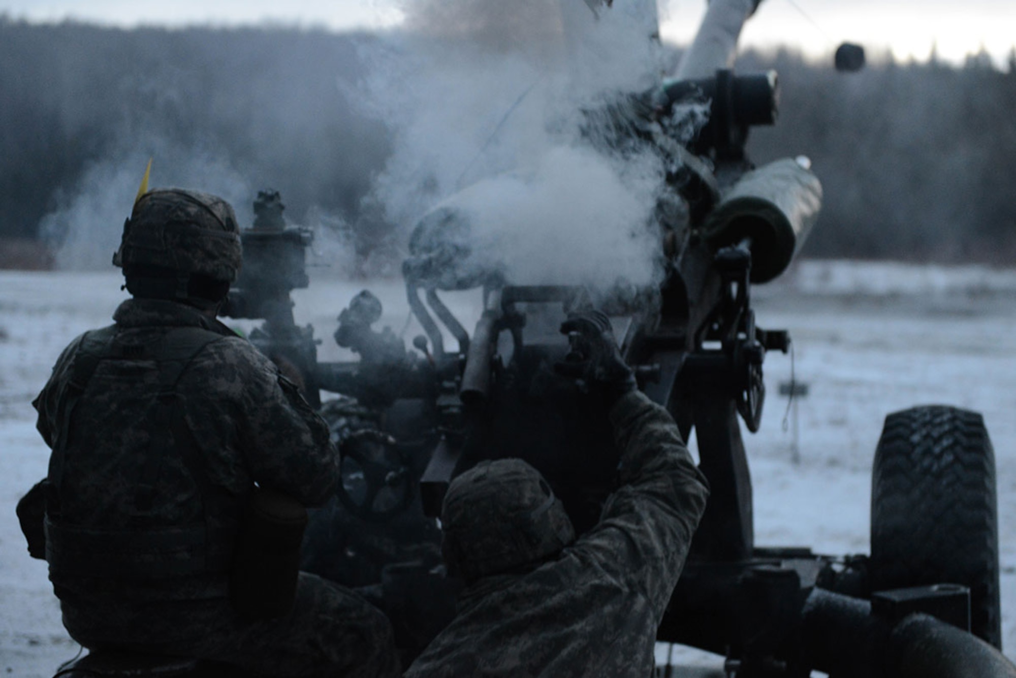 Soldiers assigned to the B Battery, 2nd Battalion, 377th Parachute Field Artillery Regiment, 4th Infantry Brigade Combat Team (Airborne), 25th Infantry Division, U.S. Army Alaska, perform live fire mission with the M119 105mm Howitzer Monday, Jan. 11, 2016. The live fire missions are performed in preparation for a deployment to the Joint Readiness Training Center in Fort Polk, Louisiana. (U.S. Air Force photo/Airman 1st Class Javier Alvarez)
