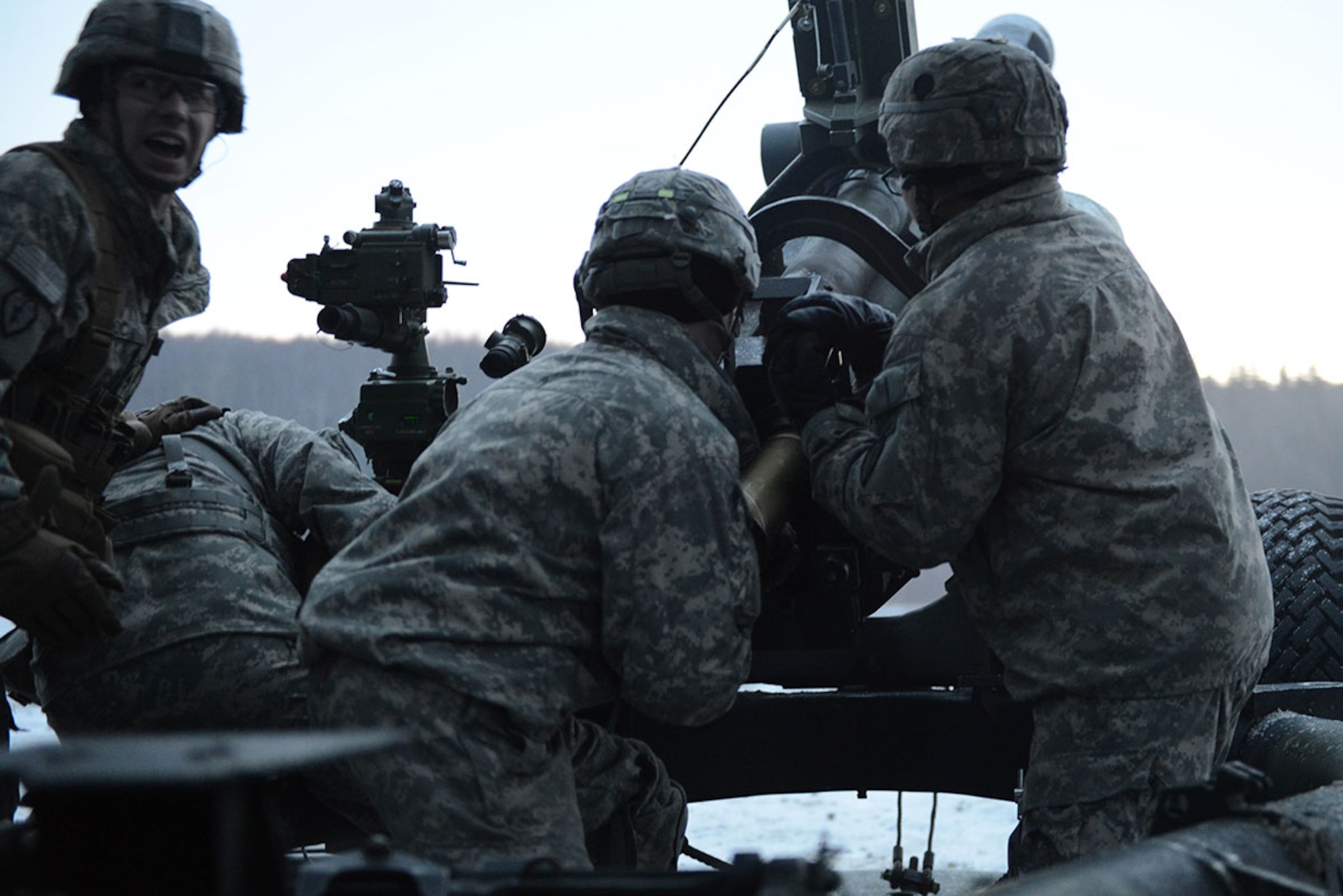 Soldiers assigned to B Battery, 2nd Battalion, 377th Parachute Field Artillery Regiment, 4th Infantry Brigade Combat Team (Airborne), 25th Infantry Division, U.S. Army Alaska, load an M119A2 105mm howitzer Monday, Jan. 11, 2016.  The M119 was first deployed in the 7th Infantry Division, Fort Ord in December 1989. (U.S. Air Force photo/Airman 1st Class Javier Alvarez)