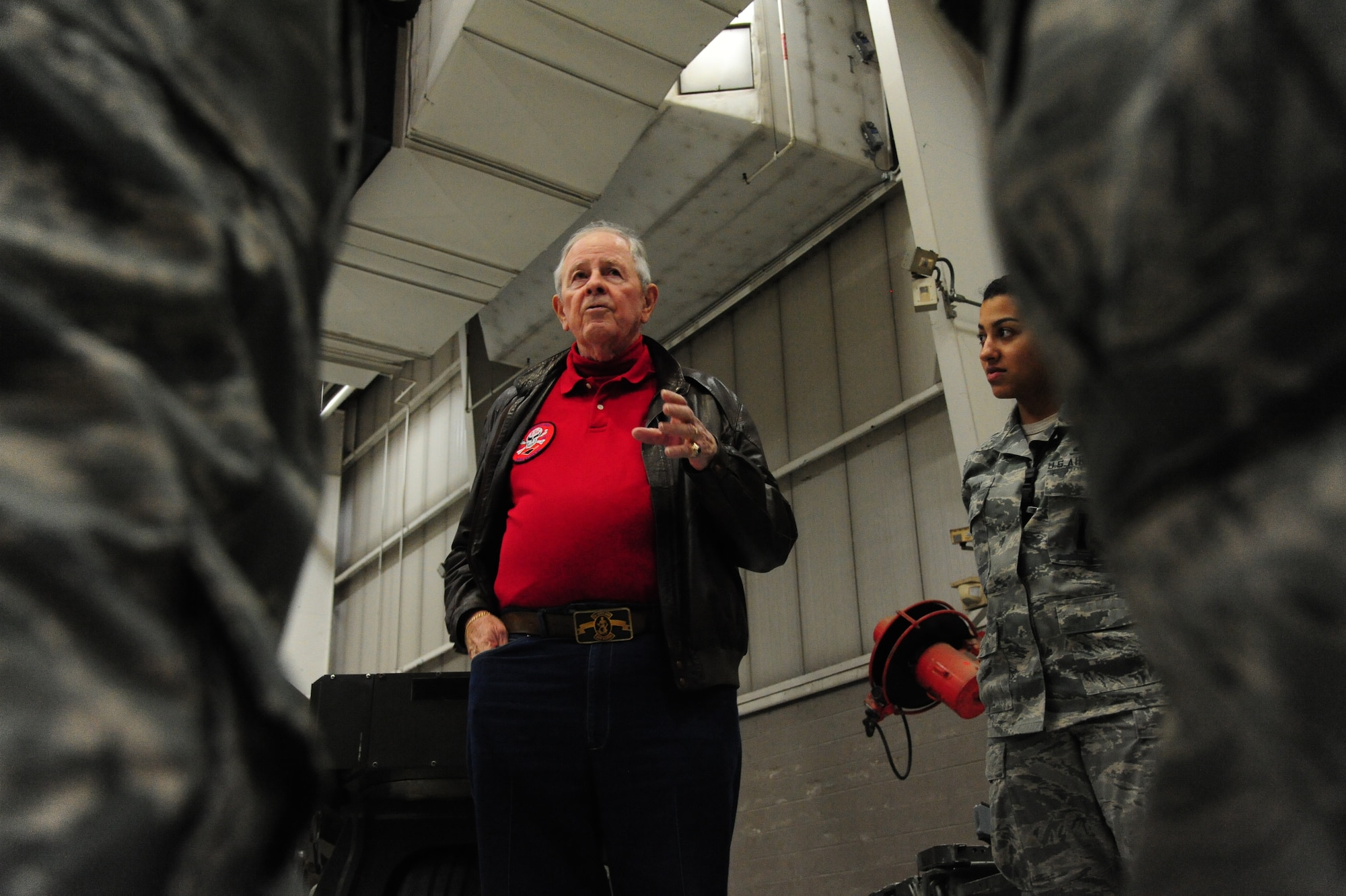 Charlie Brown, the 13th Bomb Squadron Association president, talks to Airmen from the 13th Aircraft Maintenance Unit at Whiteman Air Force Base, Mo., Dec. 17, 2015. The veterans were proud to share their piece of legacy with the young Airmen, discussing the aircraft from their time in comparison with those of today’s mission.  (U.S. Air Force photo by Senior Airman Keenan Berry)