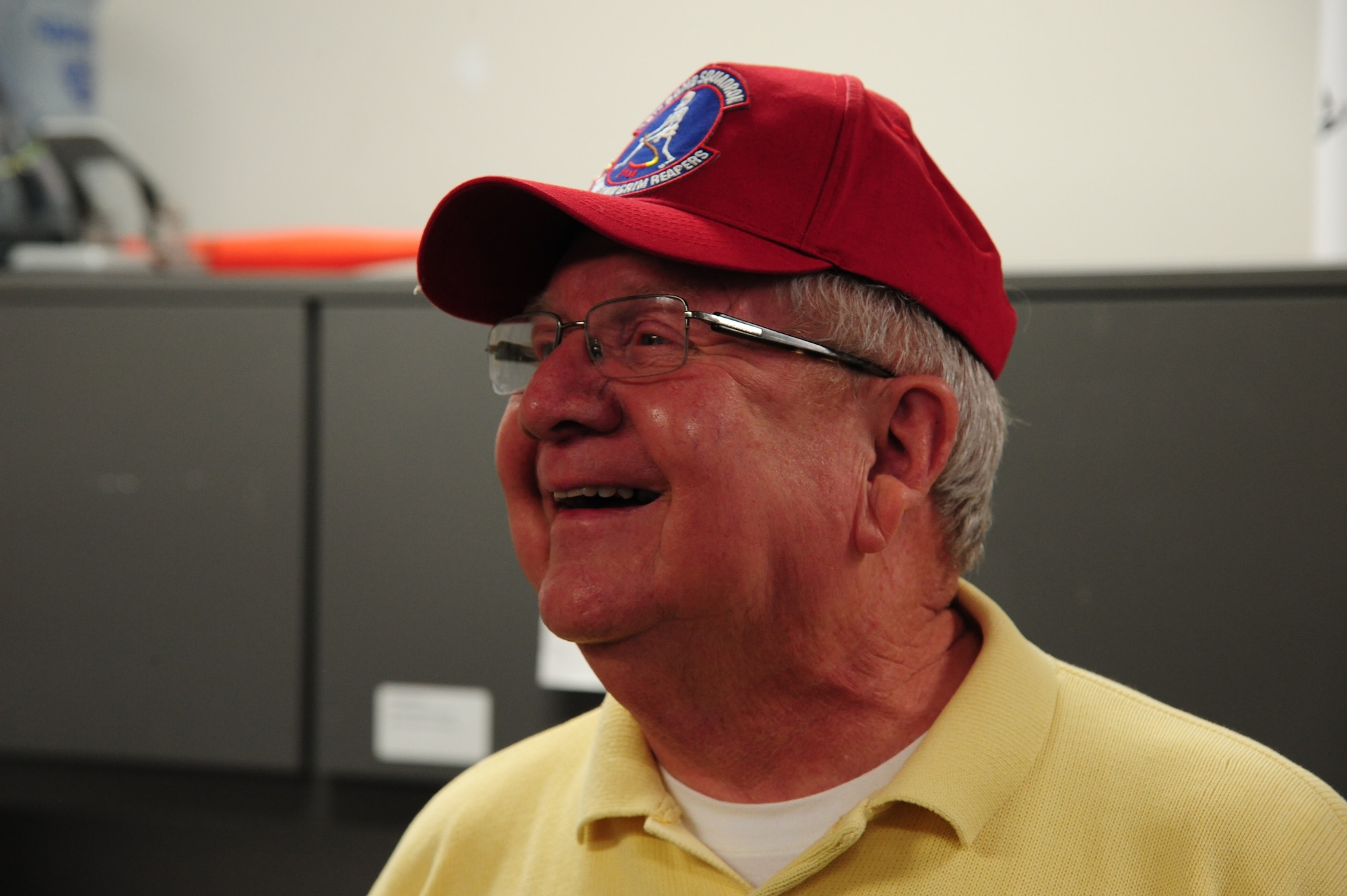 Bob Parks, the 13th Bomb Squadron Association (BS) vice president, smiles during his visit at Whiteman Air Force Base, Mo., Dec. 17, 2015. The value of the visit to was to inform Airmen of the unit’s lineage and educate them on opportunities to carry on that legacy through the association. (U.S. Air Force photo by Senior Airman Keenan Berry)