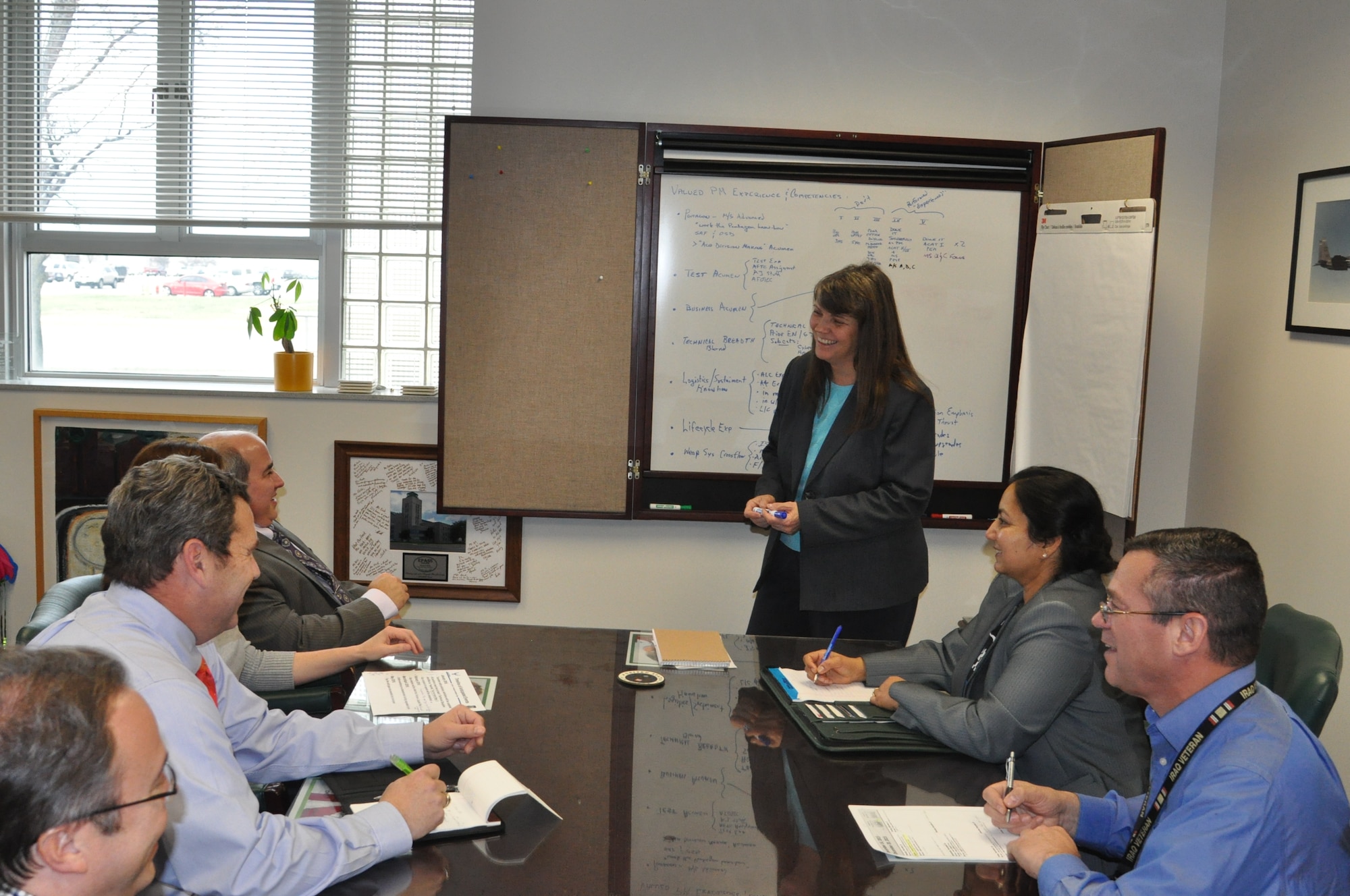 Dr. Beverley Gable (center), Air Force Life Cycle Management Center's senior functional chief for Test and Evaluation, meets with members of her staff. Gable leads the Center Test Authority, which is responsible for supporting acquisitions professionals in planning for and conducting tests of Air Force systems. (U.S. Air Force photo/Brian Brackens)  
