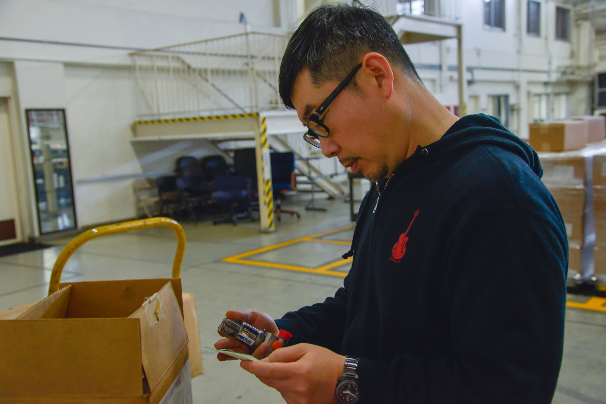 Takashi Taneyama, 374th Logistics Readiness Squadron materiel management flight service center technician, inspects a C-130 Hercules drain valve before it is sent to be repaired at Yokota Air Base, Japan, Jan. 11, 2016. To successfully provide the supplies and equipment to the units and aircraft, the flight is divided into two sections and nine elements. (U.S. Air Force photo by Senior Airman David Owsianka/Released)