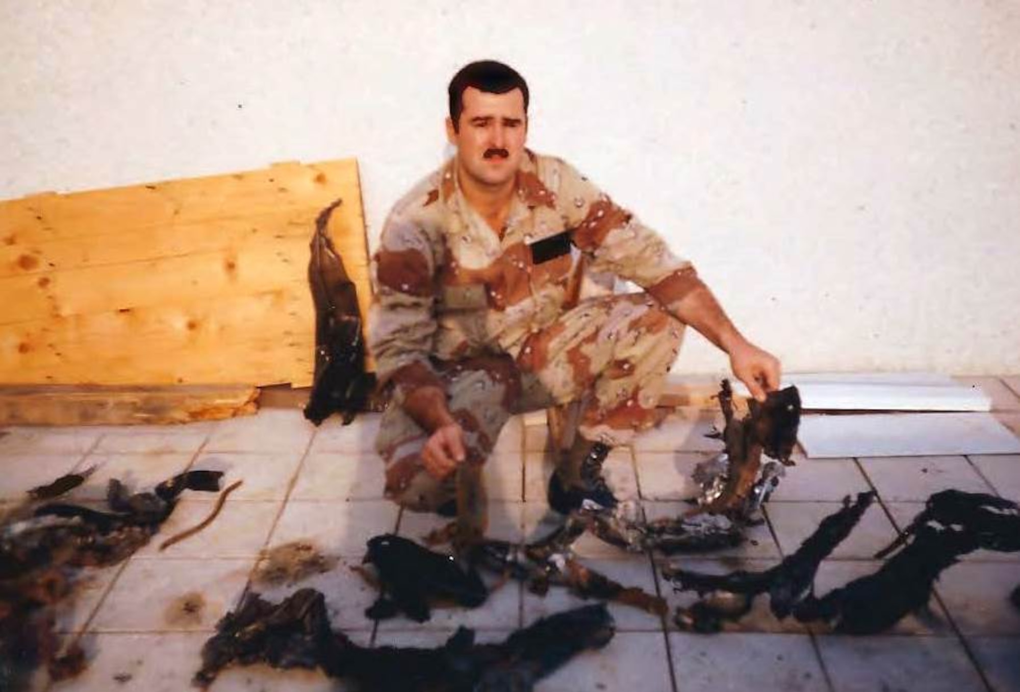 Dr. John D. Olive, then an Air Force technical sergeant, with parts of an Iraqi SCUD missile collected on his first response and recovery mission during Operation Desert Storm.  The Explosive Ordnance Disposal teams would respond after SCUD attacks to recover missiles that were either shot down, broke apart or impacted and didn’t detonate. (Courtesy photo)