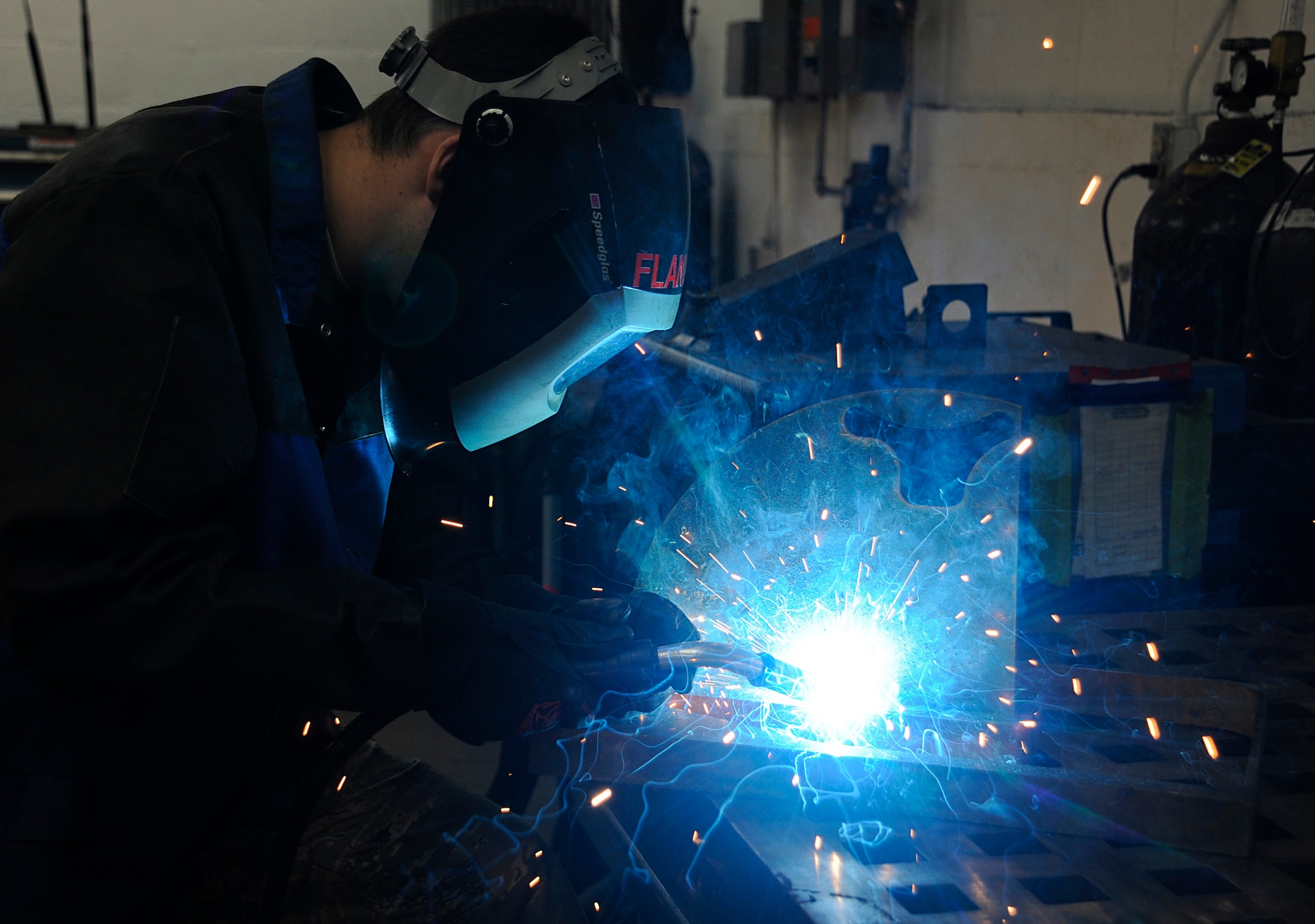 Senior Airman Andrew Flanagan, an aircraft metals technology technician with the 6th Maintenance Squadron, practices metal inert gas (MIG) welding at MacDill Air Force Base, Fla., Jan. 7, 2016. The purpose of MIG welding is to fuse and assemble two pieces of similar metal together. (U.S. Air Force photo by Airman 1st Class Mariette M. Adams)