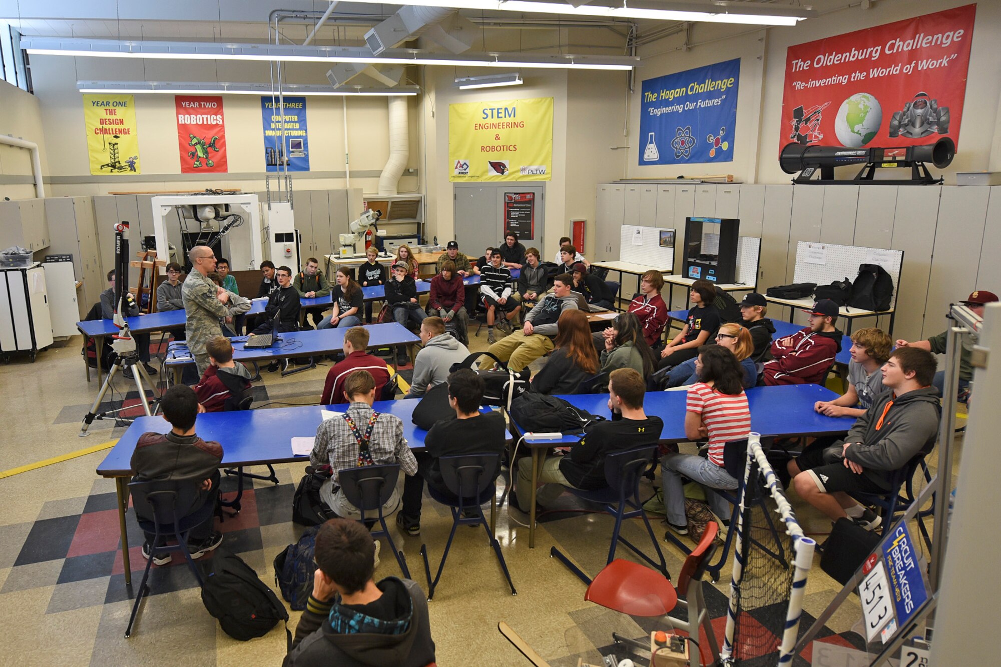 Staff Sgt. Adam Fillman, 92nd Maintenance Squadron metals technology craftsman, discusses his journey to joining the Air Force with engineering and mechanics students Jan. 13, 2016, at Medical Lake High School, Medical Lake, Wash. Fillman tried many things before joining the Air force and becoming a metals technology craftsman including once working as a bicycle mechanic. (U.S. Air Force photo/Airman 1st Class Mackenzie Richardson)