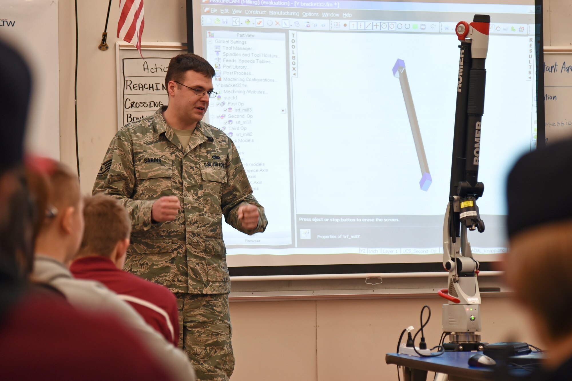 Staff Sgt. Robert Sabins, 92nd Maintenance Squadron metals technology craftsman, discusses the process of re-creating parts with engineering and mechanics students Jan. 13, 2016, at Medical Lake High School, Medical Lake, Wash. The presentation was part of a day-long visit that incorporated more than 65 students. (U.S. Air Force photo/Airman 1st Class Mackenzie Richardson)