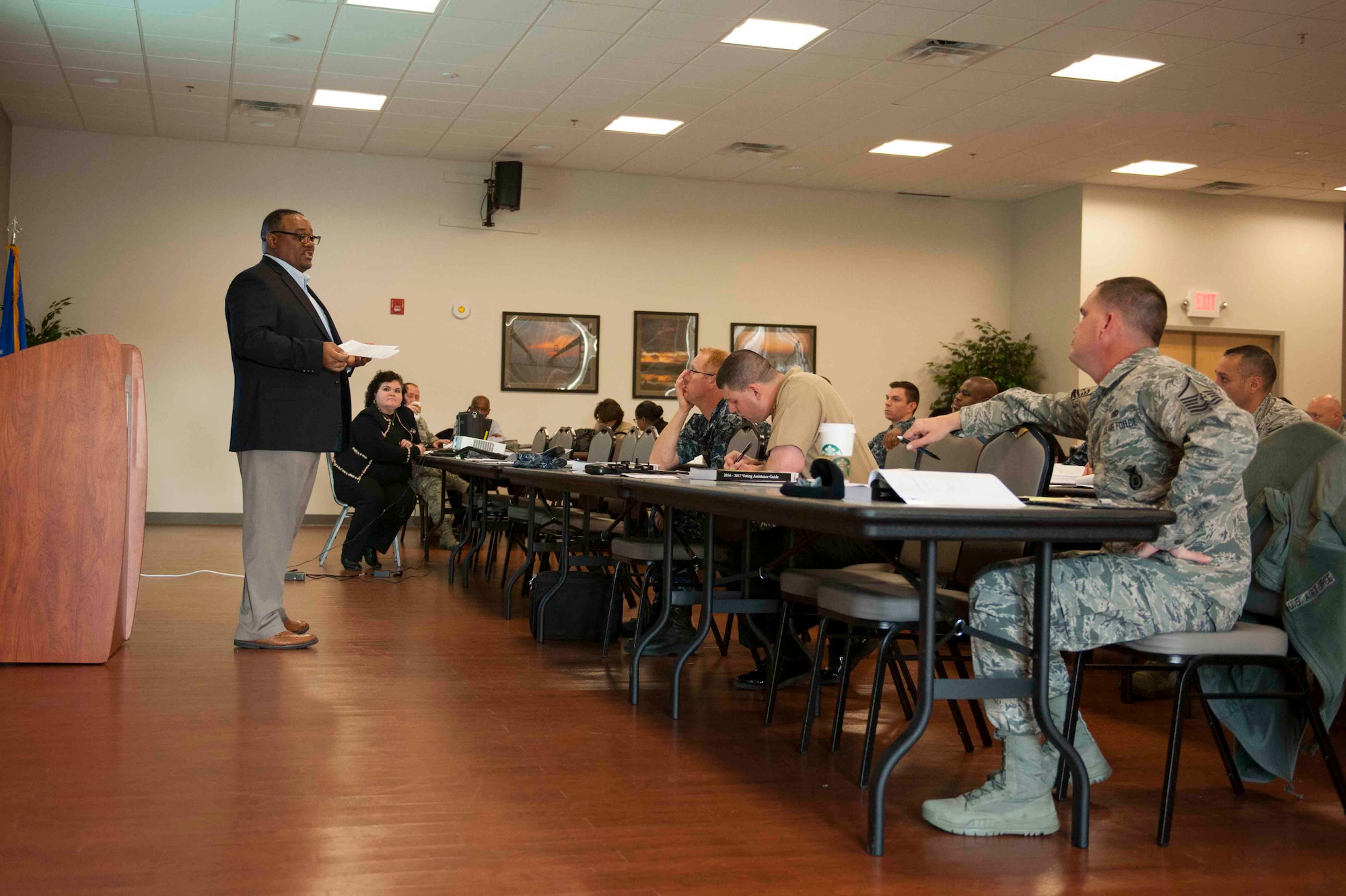 Kenneth Warford, Federal Voting Assistance Program, policy and project compliance deputy director, briefs attendees during a Voting Assistance Workshop at Joint Base Andrews, Md., Jan. 12, 2016. The workshop, run by the Federal Voting Assistance Program, trained more than 50 Department of Defense members on providing assistance to service members and their families during the voting process. (U.S. Air Force photo by Senior Airman Dylan Nuckolls/Released)