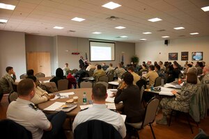 Kenneth Warford, Federal Voting Assistance Program deputy director, Policy and project compliance and training facilitator, briefs attendees during a Voting Assistance Workshop at Joint Base Andrews, Md., Jan. 12, 2016. The workshop, run by the Federal Voting Assistance Program, trained more than 50 Department of Defense members on providing assistance to service members and their families during the voting process. (U.S. Air Force photo by Senior Airman Dylan Nuckolls/Released)