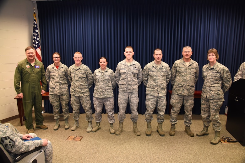 SIOUX FALLS, S.D. - Col. Russ Walz, far left, and Command Chief Master Sgt. Jeanne Gacke, far right, congratulate the 2015 Diamond Sharp award winners during a ceremony held at Joe Foss Field, S.D. Jan. 10, 2016.  Pictured recipients, left to right, Airman First Class Alexis Horstman, 114th Operations Support Squadron, Technical Sgt. Daniel Bones, 114th Civil Engineer Squadron, Technical Sgt. Jacklynn Small, 114the Logistics Readiness Squadron, Senior Airman Aaron Engebretson, 114th Security Forces Squadron, Technical Sgt. Nick Blumer, 114th Maintenance Squadron, Master Sgt. Kevin Winter, 114th Aircraft Maintenance Squadron.  Recipients not pictured are Technical Sgt. Rachel Vanbeek, 114th Medical Squadron, Senior Airman Jason Collins, 114th Mission Support Group, and Technical Sgt. Danny Oaks, HQ SDANG. (U.S. Air National Guard photo by Staff Sgt. Luke Olson/Released)