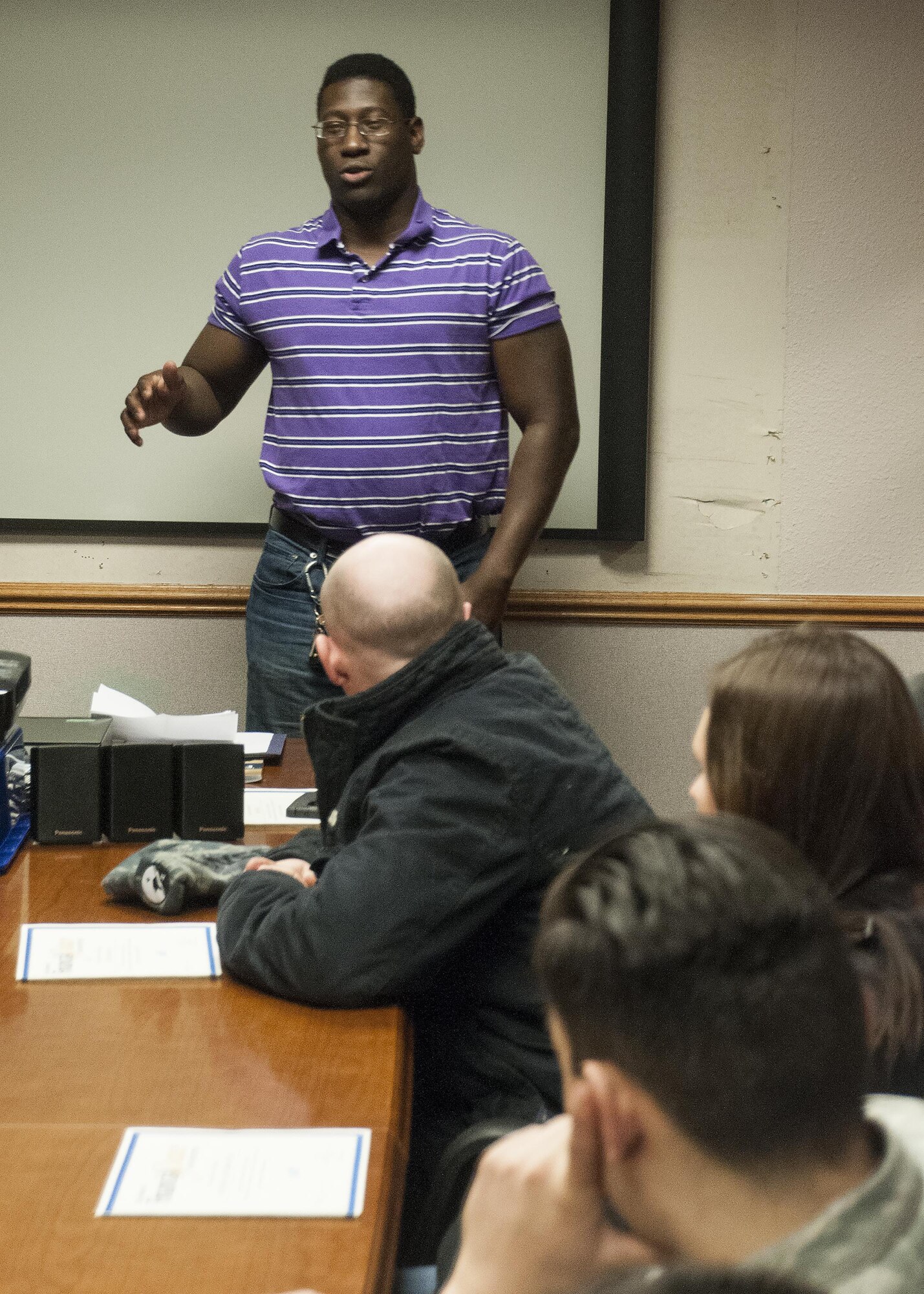 Senior Airman Darin Smith, 90th Logistics Readiness Squadron hazardous materials technician, speaks to fellow Financial Peace University graduates and new students in the Chapel Activity Center on F.E. Warren Air Force Base, Wyo., Jan. 11, 2015, about his experience in the the 12-week FPU course. The FPU class at F.E. Warren is hosted by the 90th Missile Wing Chapel, and it gives students lessons on financial responsibility and generating weatlh. (U.S. Air Force photo by Senior Airman Jason Wiese)