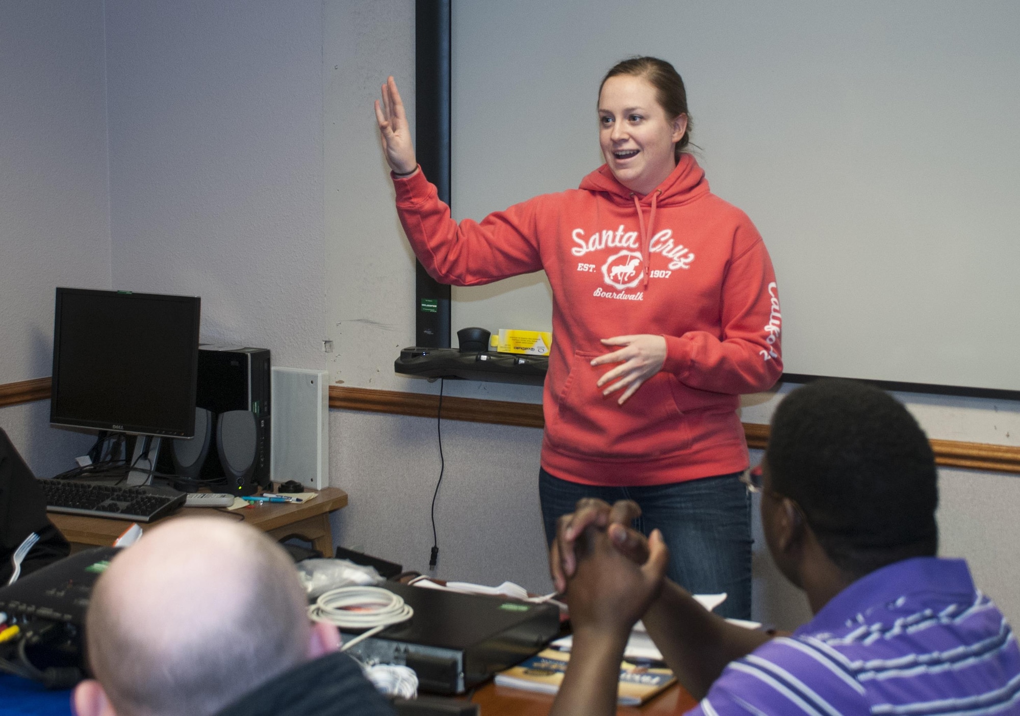 First Lt. Megan Olson, 90th Munitions Squadron maintenance accountability officer, speaks to fellow Financial Peace University graduates and new students in the Chapel Activity Center on F.E. Warren Air Force Base, Wyo., Jan. 11, 2015, about her experience in the the 12-week FPU course. The new class had their first session the same night as the previous class graduated. (U.S. Air Force photo by Senior Airman Jason Wiese)