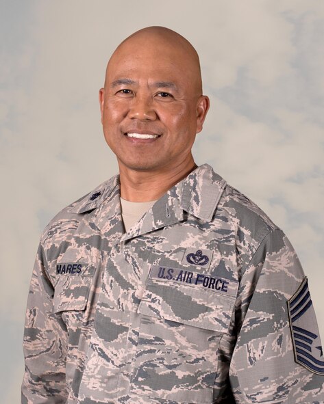 U.S. Air Force Lt. Col. Robert Pumares, 380th Expeditionary Medical Group aerospace medicine and dental flight commander, is pictured with both chief master sergeant and lieutenant colonel ranks, representing the pinnacle of his enlisted and officer careers. Pumares enlisted in the USAF Oct. 1981 and achieved the rank of Lt. Col. Sept. 2013. (U. S. Air Force illustration by Tech. Sgt. Frank Miller/Released)