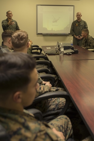 Gunnery Sgt. Victor Velez, left, manpower chief and Gunnery Sgt. Jimmy Ensley, maintenance control chief with Marine Helicopter Squadron One answer questions during an HMX-1 brief at Marine Corps Air Station Iwakuni, Japan, Jan. 14, 2016. The brief afforded HMX-1 Marines the opportunity to provide information and answer questions about the career opportunities available to pilots, crew chiefs, aircraft maintainers and many other Marines at HMX-1. HMX-1 is responsible for direct helicopter support of the White House, which includes supporting the president, vice president, secretary of defense, secretary of the Navy, commandant of the Marine Corps and all visiting heads of state in the Washington, D.C., area.