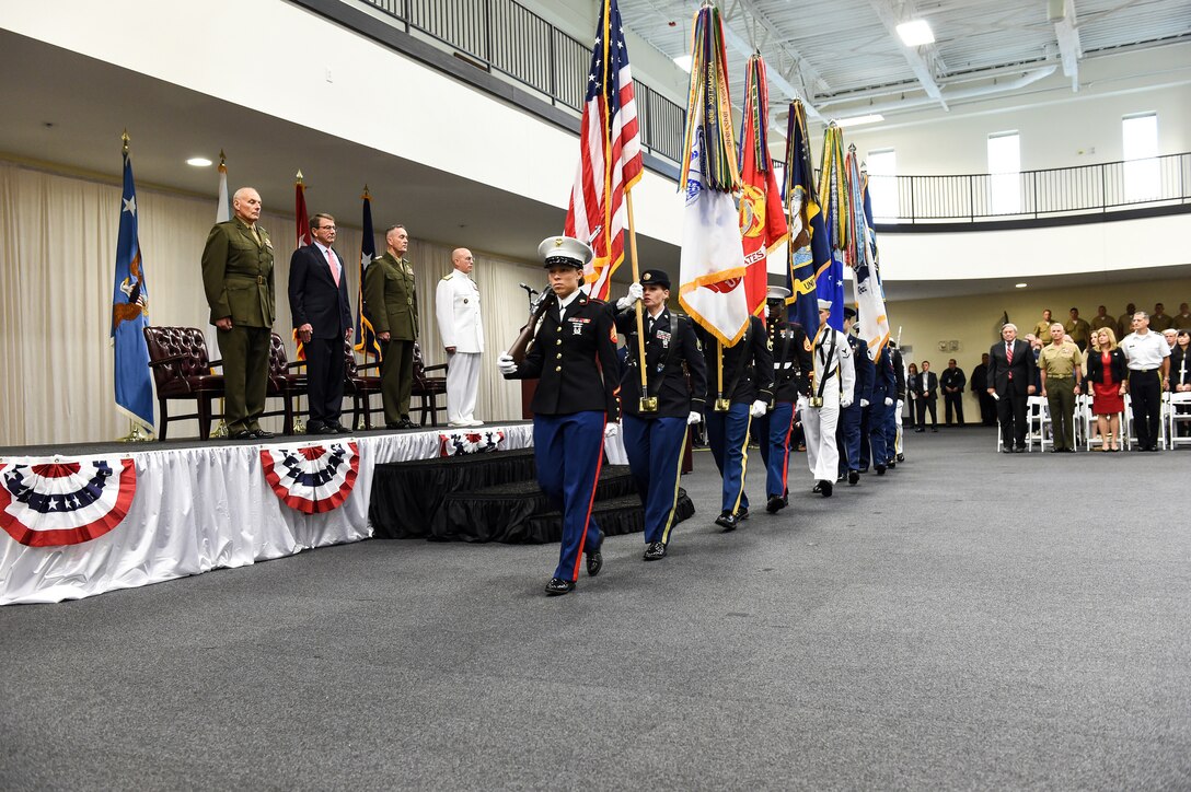 Defense Secretary Ash Carter, Marine Corps Gen. Joseph F. Dunford, chairman, Joint Chiefs of Staff,  Marine Corps Gen. John F. Kelly and Navy Adm. Kurt W. Tidd stand at attention during U.S. Southern Command's  change of command on MacDill Air Force Base, Jan. 14, 2016. DoD photo by Army Sgt. 1st Class Clydell Kinchen
