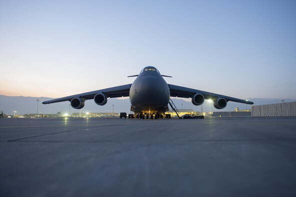 A C-5 Galaxy from Travis Air Force Base, Calif., sits on the flightline as the sun sets prior to a sortie at Bagram Airfield, Afghanistan, Dec. 28, 2015. The C-5 is a heavy airlifter with intercontinental range. It is the largest U.S. military aircraft, capable of carrying more than 270,000 pounds of cargo. (U.S. Air Force photo/Tech. Sgt. Robert Cloys)