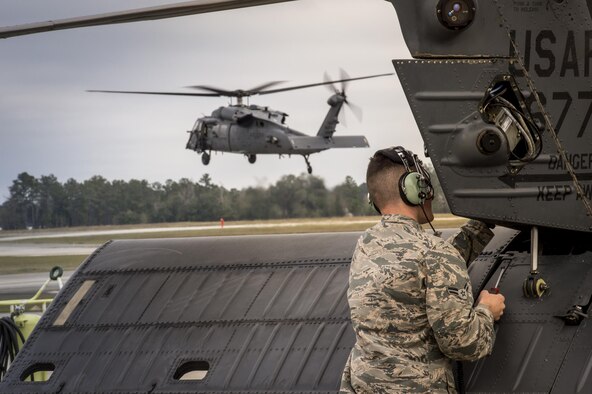 An Airman from the 41st Helicopter Maintenance Unit attaches a panel to the tail of an HH-60G Pave Hawk Jan. 7, 2016, at Moody Air Force Base, Ga. The 41st HMU works 24/7 to ensure aircraft  are ready to fly at a moment’s notice. (U.S. Air Force photo/Senior Airman Ryan Callaghan)
