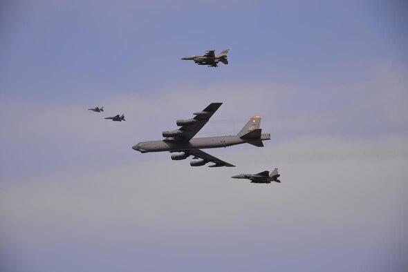 A U.S. Air Force B-52 Stratofortress from Andersen Air Force Base, Guam, conducted a low-level flight in the vicinity of Osan Air Base, South Korea, in response to recent provocative action by North Korea Jan. 10, 2016. The B-52 was joined by a South Korean F-15K Slam Eagle and a U.S. Air Force F-16 Fighting Falcon. The B-52 is a long-range heavy bomber that can fly up to 50,000 feet and has the capability to carry 70,000 pounds of nuclear or precision guided conventional ordnance with worldwide precision navigation capability. (U.S. Air Force photo/Staff Sgt. Benjamin Sutton)