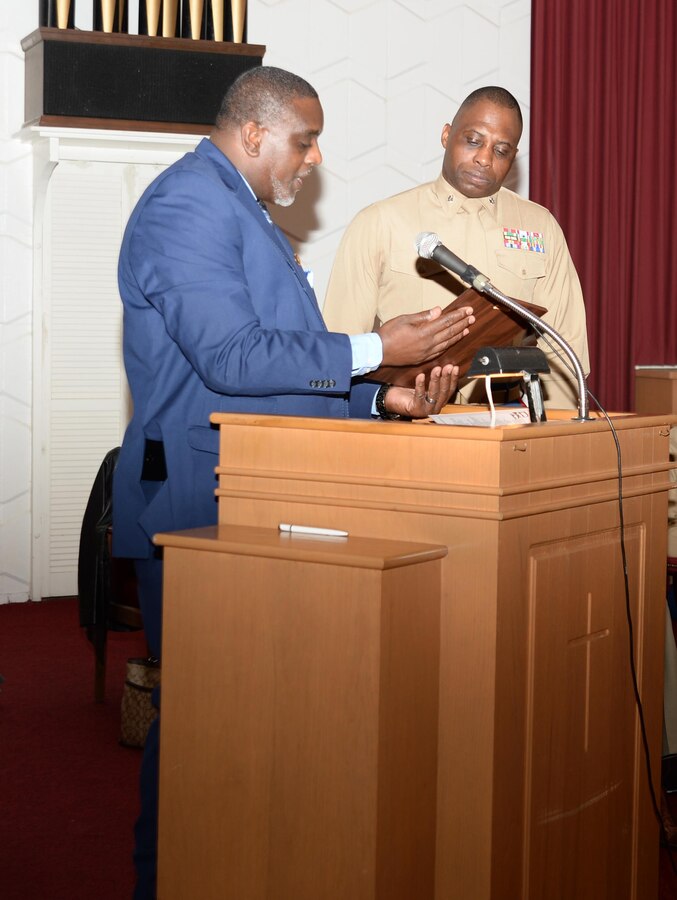 Ira Thompson (left), Inspector General, Marine Corps Logistics Command, and president of the Albany Area Chapter of Blacks in Government, presents an award to Lt. Col. George Lampkin, deputy director, C4, LOGCOM. Lampkin delivered the keynote speech at the installation’s annual commemoration of the life and legacy of Dr. Martin Luther King Jr., which was held at the Chapel of the Good Shepherd, Jan. 13.
