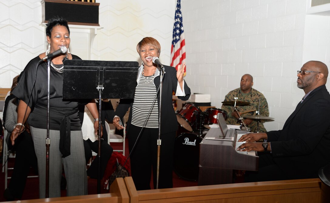 Members of the Marine Corps Logistics Base Albany Choir, Latreesa Perryman (left) and Jackie Johnson, accompanied by pianist, Steven Spraggins, entertain attendees with a duet during the installation’s 2016 observance of the life and legacy of Dr. Martin Luther King Jr. The celebration, which is an annual event, was held at the installation’s Chapel of the Good Shepherd, Jan. 13.

