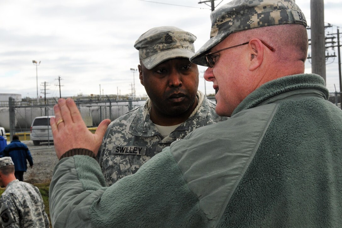 Army Lt. Col. Rob Roy Billings, foreground, instructs Staff Sgt. Michael Swilley during Operation Winter River Flooding in Krotz Springs, La. Jan. 10, 2016. Swilley is assigned to the Louisiana Army National Guard’s 256th Infantry Brigade Combat Team. Louisiana National Guard photo by Army Staff Sgt. Greg Stevens